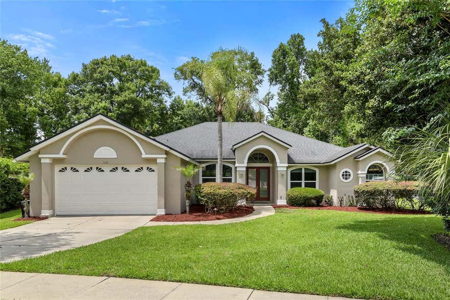 Nestled on a quiet cul-de-sac within the highly sought-after Sabal Point community, this stunning 4-bedroom, 2-bath residence offers the perfect blend of elegance, comfort, and privacy. Spanning 2,521 square feet, the thoughtfully designed split-floor plan delivers both functionality and flexibility, all within a highly rated Seminole County school district. 
Set on a spacious 1/2-acre homesite, this property offers exceptional outdoor living, privacy, and room to enjoy Florida’s natural beauty. From the moment you enter, this home invites you in with soaring vaulted ceilings and expansive windows, framing breathtaking views of the screened-in pool, oversized pool deck, and serene conservation backdrop. The light-filled interior showcases porcelain tile and engineered wood flooring throughout, adding warmth and sophistication to every room.
The heart of the home is the stunning kitchen featuring abundant wood cabinetry, center island, granite countertops, a breakfast bar, and an eat-in dining area. The kitchen seamlessly flows into the spacious family room anchored by a cozy wood-burning fireplace, vaulted ceilings,  and spectacular views through the abundance of windows.
The private primary suite serves as a true retreat, complete with relaxing views of the backyard pool and nature reserve. The luxury continues in the en-suite bath with dual sinks, a jetted tub, and a separate spa-like rain shower with embedded shower jets. Both bathrooms have been fully remodeled with granite countertops and elevated designer finishes. The versatile fourth bedroom is ideal as a home office, den, or private guest retreat. The outdoor oasis boasts an expansive screened pool area with a sparkling pool, perfect for entertaining. Updates include new water softener (2022), new windows (2021), new wood flooring (2020), new remote controlled blinds (2021), new microwave, range hood and convection oven (2025), roof (2017), AC (2015), water heater (2019), Residents of Sabal Point enjoy access to beautiful parks, scenic walking trails, and a serene natural setting that enhances the lifestyle this community is known for.
