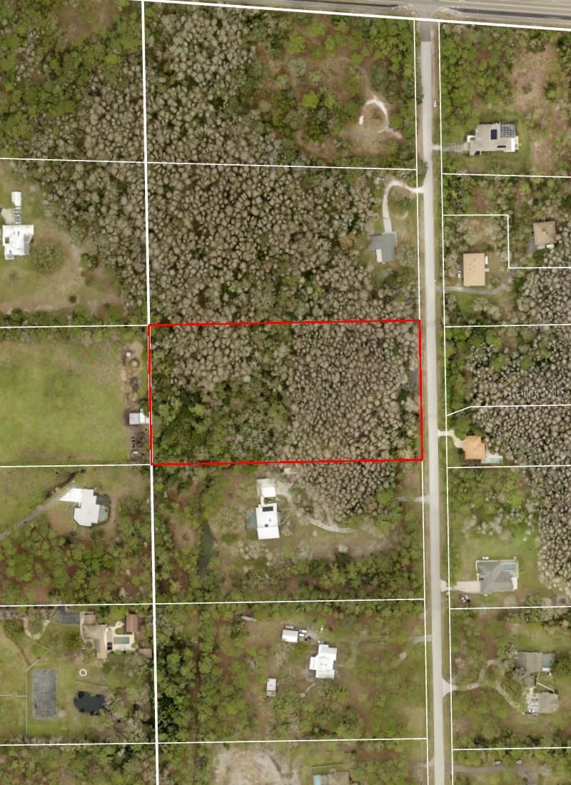 An exceptional opportunity to build a custom estate on approximately 5 acres of land in Keystone Ranchettes Unit One, located along Ranch Rd in unincorporated Tarpon Springs. This parcel, comprising the northern half of Lot 15, offers a generous footprint ideal for a private residence with additional space for a pool, guest house, equestrian features, or other luxury amenities—subject to county approval. Surrounded by large-lot homes and custom builds, this location supports high-end development with a blend of privacy and open space.
The property is zoned for residential use and is outside of any HOA, allowing for design flexibility while maintaining the integrity of the estate-style surroundings. With direct paved road access via Ranch Rd, the lot is ready for site planning, with well and septic systems permitted in the area. The absence of deed restrictions offers added freedom for architectural customization and long-term planning.
Positioned just minutes from Lake Tarpon, Brooker Creek Preserve, and local golf courses, as well as access to Tarpon Springs' historic downtown and the Gulf of Mexico coastline, this parcel offers both tranquility and proximity. For buyers seeking to develop a distinguished homestead in a location known for its estate properties and acreage homesites, this lot provides a rare blend of space, flexibility, and upscale potential.