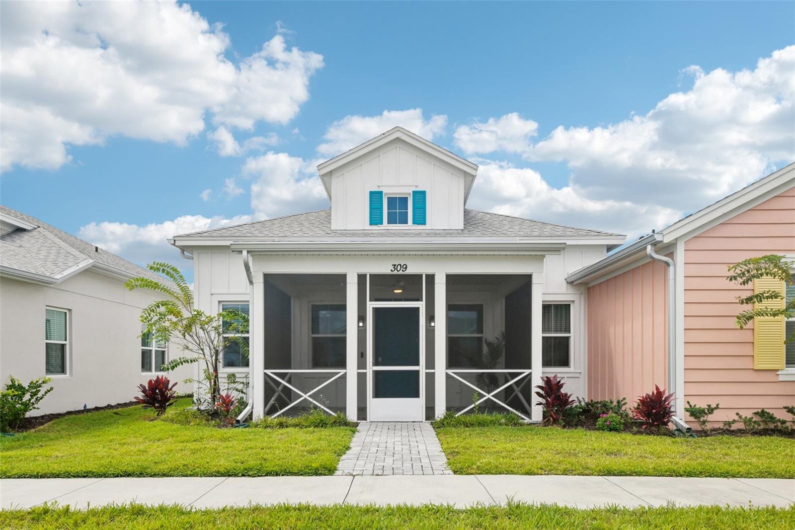 Welcome to the carefree lifestyle at Latitude Daytona Beach! Just bring a suitcase! This bright and airy cottage is less than a year old and comes fully equipped with top-of-the-line furnishings and many upgrades including vaulted ceilings with decorative beams, ceramic tile flooring, crown molding and more! The living area is open and features a gourmet kitchen, quartz counters, stainless steel appliances and a gas range. The primary suite offers a peaceful retreat with a spa-inspired bath featuring dual vanities with quartz counters and a tiled, glass-enclosed rain shower. The 2 car garage is oversized and offers shark coating floors and plenty of room for storage. At Latitude, you’ll enjoy a vibrant gated community with all of the amenities including a tropical lagoon-style resort pool with daily entertainment, plus two additional heated pools including a sports pool and indoor lap pool. Stay active with tennis, pickleball, bocce, and volleyball, or let your furry friends play at the golf cart–friendly dog park. Creative outlets abound with pottery and woodworking studios, a community theater, and the Bar & Chill restaurant. With lawn care, landscaping, exterior painting, and roof maintenance included, you’ll have more time to simply relax and enjoy the Latitude lifestyle.