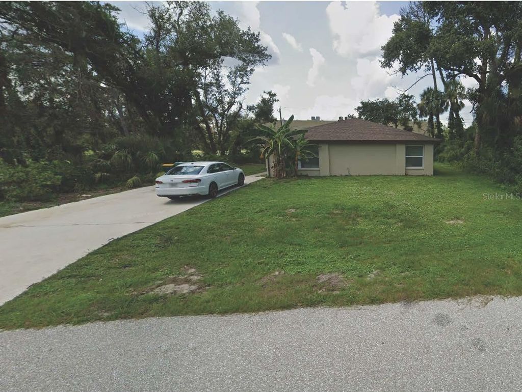 Photo of 1837 Royalview Drive #A, Port Charlotte, FL 33948 (MLS # C7512473)