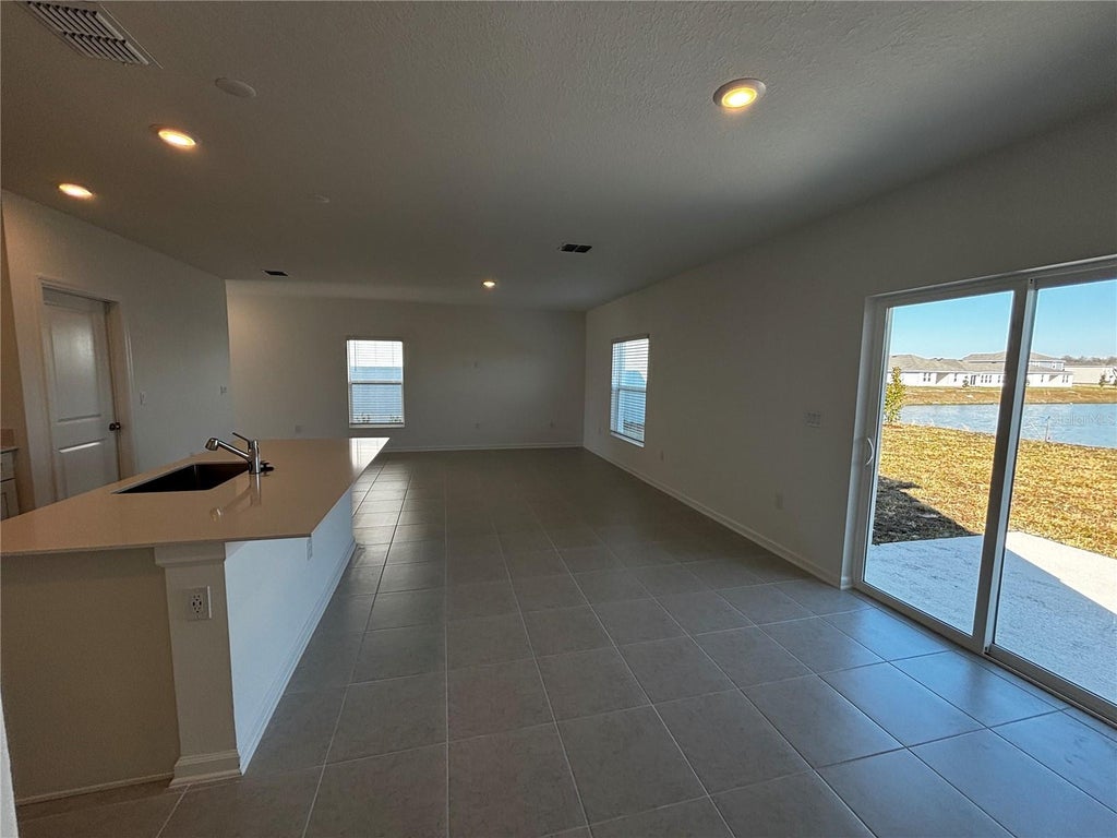Photo of 4763 Guinep Lane, Kissimmee, FL 34758 (MLS # O6413069)