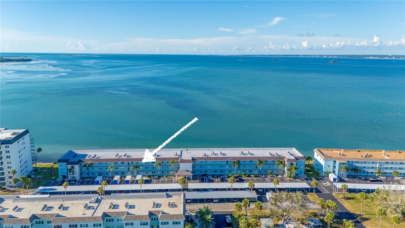 Spectacular Gulf-Front Living at Royal Stewart Arms! Welcome to the Dunoon Building at Royal Stewart Arms, where panoramic waterfront views and refined living converge. This impeccably maintained 2-bedroom, 2-bath residence showcases full, unobstructed Gulf vistas from its coveted top-floor setting—an ideal retreat to enjoy mesmerizing sunsets and daily encounters with dolphins, manatees, and coastal birdlife. Offering 1,141 sq. ft. of thoughtfully designed living space, this home features a desirable split-bedroom floor plan, ensuring both comfort and privacy. The expansive 25’ x 14’ Great Room is perfect for entertaining, while the inviting 12’ x 11’ Florida Room offers a serene perch to take in the breathtaking views. The chef-inspired kitchen is a standout, boasting 42-inch custom solid wood cabinetry paired with striking granite countertops. The primary suite is generously sized, complete with a large walk-in closet, spa-like ensuite bath, and tranquil Gulf views. A spacious second bedroom enjoys convenient access to the updated guest bath, making it ideal for visiting family or friends. No detail has been overlooked… this residence is appointed with hurricane-impact windows, elegant plantation shutters, custom crown molding, 6-inch baseboards, and brushed nickel hardware throughout. Upgraded raised-panel doors and tasteful fixtures enhance the home’s timeless sophistication. Royal Stewart Arms, a meticulously maintained 55+ community, offers resort-style amenities including a heated waterfront pool, tennis courts, fitness center, fishing pier, clubhouse, outdoor grills, and beautifully landscaped walking paths. HOA fees cover cable TV, water, sewer, gas, trash, exterior maintenance, pest control, and more. Assigned parking, elevator access, and laundry facilities on each floor add to the convenience. Ideally located on Honeymoon Island Causeway, you’ll be just moments from Honeymoon Island State Park, vibrant downtown Dunedin, award-winning restaurants, charming boutiques, and the Pinellas Trail. With over 300 feet of private Gulf frontage and direct Gulf-to-Bay water access, this is coastal living at its finest. This rare offering presents an exceptional opportunity to own a move-in ready, Gulf-front condo in one of Dunedin’s most sought-after waterfront communities.