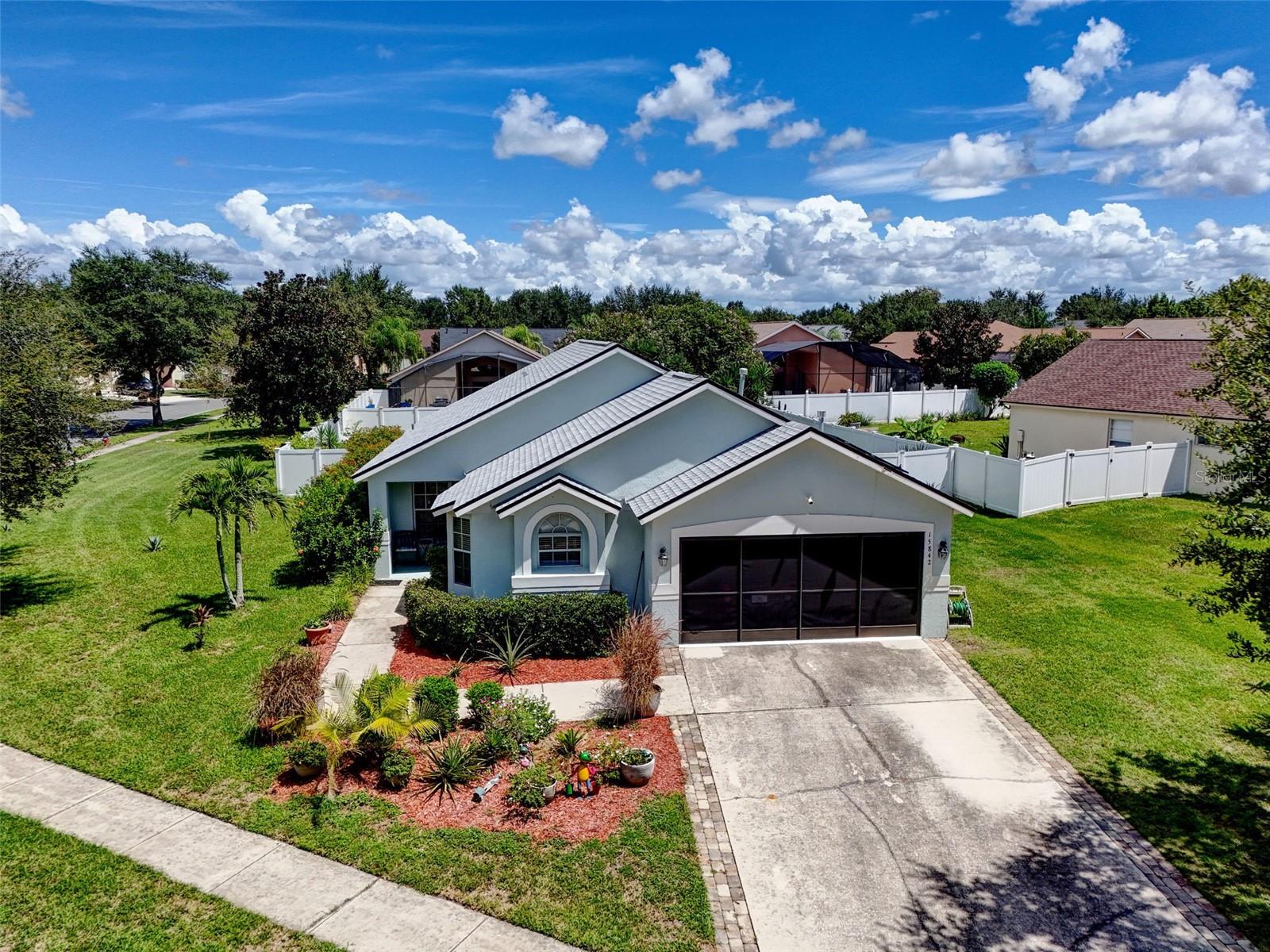 Welcome to 15842 Robin Hill Loop in Clermont! This 4- Bedroom (with 2 Primary Suites!), 3 Full Bathroom move-in ready Pool Home is on one of the best lots in the neighborhood is loaded with major updates and thoughtful features inside and out!
Peace of mind comes easy here with a new roof (2023), roof-mounted photovoltaic solar system (2020) seller is willing to pay off the balance with an acceptable offer so you can enjoy extremely low power bills year-round, a newer AC (2020), and a new gas water heater (2024). These major upgrades give you lasting efficiency and value from day one!
Step inside and you’ll immediately notice the Wood-Look Porcelain Tile that flows through the main living areas and primary suite, combining warmth with durability. This flexible and open layout features dual primary suites, ideal for multigenerational living or hosting extended family. The home is filled with natural light thanks to large windows and sliding doors that connect seamlessly to your outdoor retreat.
The kitchen is equipped with stainless steel appliances, ample cabinetry, and sunny breakfast space framed by large windows. Secondary bedrooms feature brand new carpet, while the oversized living room provides high ceilings and an inviting space for gatherings with a direct view of the pool.
Out back, enjoy your gas-heated pool and jacuzzi under a full screen enclosure, perfect for year-round relaxation and entertaining. The fully fenced backyard offers privacy, and the oversized corner lot (1/3 acre) gives you room to breathe - one of the best positions in the neighborhood. Even the garage is designed with lifestyle in mind, featuring a sliding tractor screen door so you can use the space comfortably, even in the Florida summers.
This well-maintained community is full of mature trees and landscaping, offering a welcoming setting with rare flexibility: it allows owner occupants, short-term rentals, vacation rentals, and long-term rentals. There are tennis courts, pickleball courts, a large sports field and a playground! Whether you’re looking for a personal residence or an investment property, this home checks every box at a very reasonable asking price.
With its unbeatable list of upgrades, dual-suite layout, resort-style outdoor living, and prime lot, 15842 Robin Hill Loop is one of the strongest values on the market today. Schedule your showing and see it for yourself!