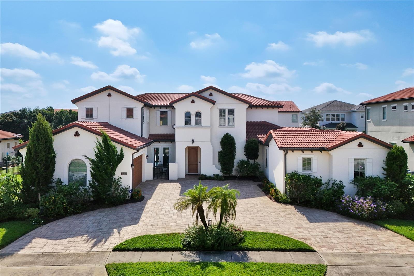 Opportunity Awaits in the Sought-After Lakeshore Community!
Welcome to the popular Maranello model by Toll Brothers—an impressive and luxurious two-story home nestled in the heart of Horizon West’s premier Lakeshore community. Boasting 4,693 square feet of thoughtfully designed living space, this elegant residence features 5 bedrooms, 4.5 bathrooms, and a multipurpose bonus room perfect for a home office, game room, or media space. One of the standout features of this impressive home is the oversized In-Laws Suite with its private entrance, offering flexibility and comfort for extended family or guests. Whether you're entertaining or simply enjoying everyday living, this home provides both elegance and functionality in equal measure.
With an open-concept layout, the heart of the home is the gourmet kitchen, beautifully appointed with an oversized island, KitchenAid stainless steel appliances, double ovens, and custom cabinetry with convenient pull-out drawers. The kitchen overlooks the light and airy living room, creating a seamless connection between cooking, dining, and relaxation. From here, step out to the covered outdoor lanai and the expansive oversized deck—an entertainer’s dream, ideal for hosting gatherings, celebrations, or simply enjoying Florida’s beautiful weather year-round. The primary bedroom is located on the first floor with an en-suite bathroom, while the second floor offers large secondary bedrooms and a spacious bonus room. The community offers exceptional amenities, including a state-of-the-art recreation center overlooking two beautiful lakes, a lakefront clubhouse with fitness center, resort-style pool, firepit, summer kitchen, two playgrounds, sand volleyball courts, hammocks, club room, dog park, jogging trails, and more. The HOA covers 1 gigabit internet, community activities for adults and kids alike, all landscape and irrigation maintenance, as well as outdoor pest control. Lakeshore is zoned for top-rated schools, and it is located minutes away from the Theme Parks, new restaurants, shopping, and entertaining areas, and it is situated next to the Orange County National Golf Course, a 36-hole Championship Course. Call to schedule a private showing today.