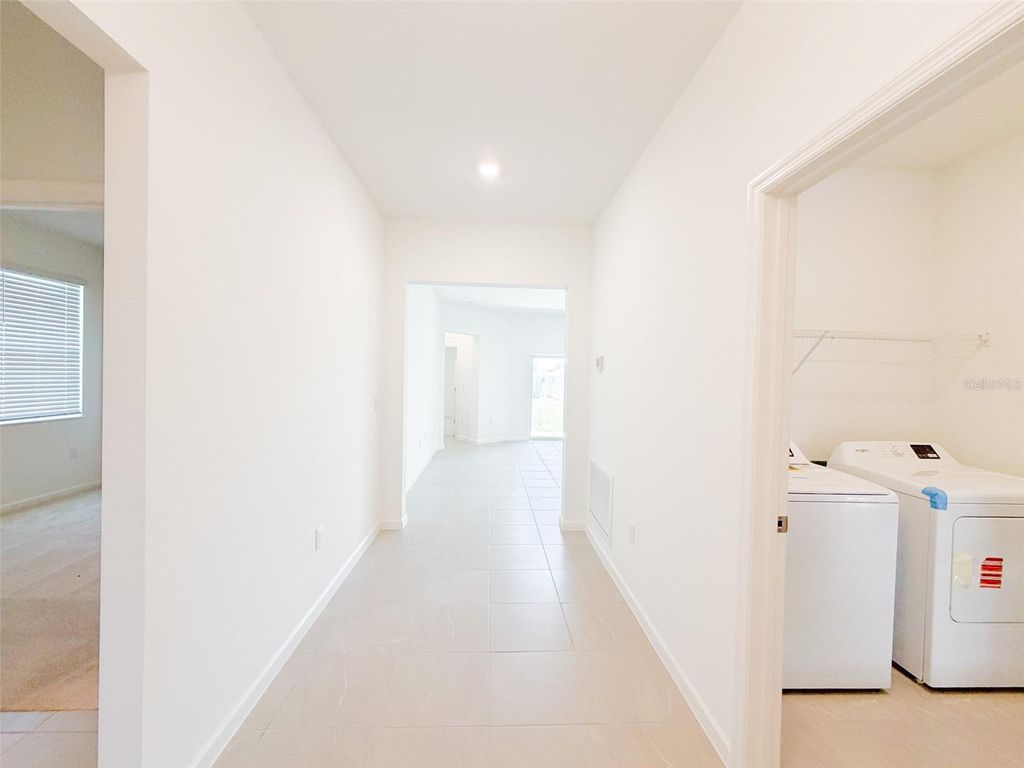 Photo of 2023 Firethorn Loop, Haines City, FL 33844 (MLS # O6403879)