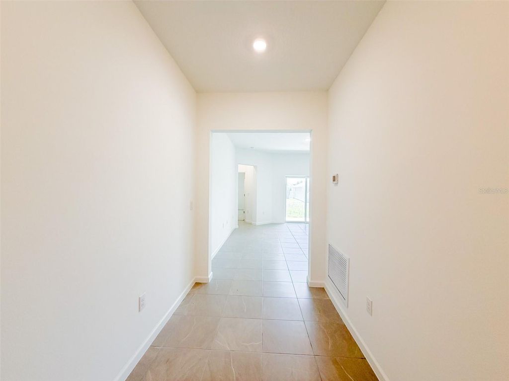 Photo of 2023 Firethorn Loop, Haines City, FL 33844 (MLS # O6403879)
