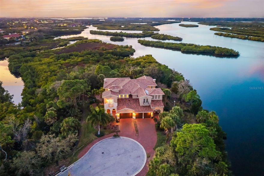 This one-of-a-kind residence in Waterlefe Golf & River Club offers a rare blend of Manatee River vistas and secluded preserve living. Forget the shutters! This gorgeous home just got a major upgrade. With a brand-new roof in 2025 and hurricane impact windows installed, you’re looking at the ultimate "lock and leave" lifestyle. Positioned at the end of a private cul-de-sac, the home was specifically reconfigured to maximize westward-facing sunset views and natural privacy. Inside, artisan woodworking and soaring ceilings define the architectural aesthetic. The layout flows seamlessly from an open-concept kitchen and fireside family room to a dedicated dining area and an expansive pantry with integrated storage. A vaulted bonus room, anchored by a stately chandelier and custom millwork, serves as a refined retreat for hosting, inclusive of French doors that open to one of the home’s three private outdoor escapes. The backyard oasis features a private pool with convenient access to a built-in grill and custom firepit, all framed by lush, undisturbed greenery. Upstairs, newly installed luxury vinyl plank (LVP) flooring leads to a primary suite designed as a viewing gallery for the river. The 35-foot screened balcony provides a quiet sanctuary, combined with an over-the -top primary bathroom - allowing you to escape from the hustle and bustle of daily life - combining to create the perfect vantage point for morning coffee or evening sunsets. Follow the walkway overlooking the lower level to the front of the home which leads to the third bedroom. Featuring French doors and its own private balcony, this space offers elevated views of the saltwater preserve and the 1st and 9th holes of the championship golf course.  Waterlefe is more than a home; it's a destination. The renovated River Club serves up resort amenities including a restaurant, fitness center, Tiki bar, and Junior Olympic pool. Intertwined with Waterlefe Golf Club - host of the US Open Local qualifier an unprecedented 8 times! Discover why this "one-of-one" floor plan is the hallmark of the #lefelife.. Taxes include the CDD.