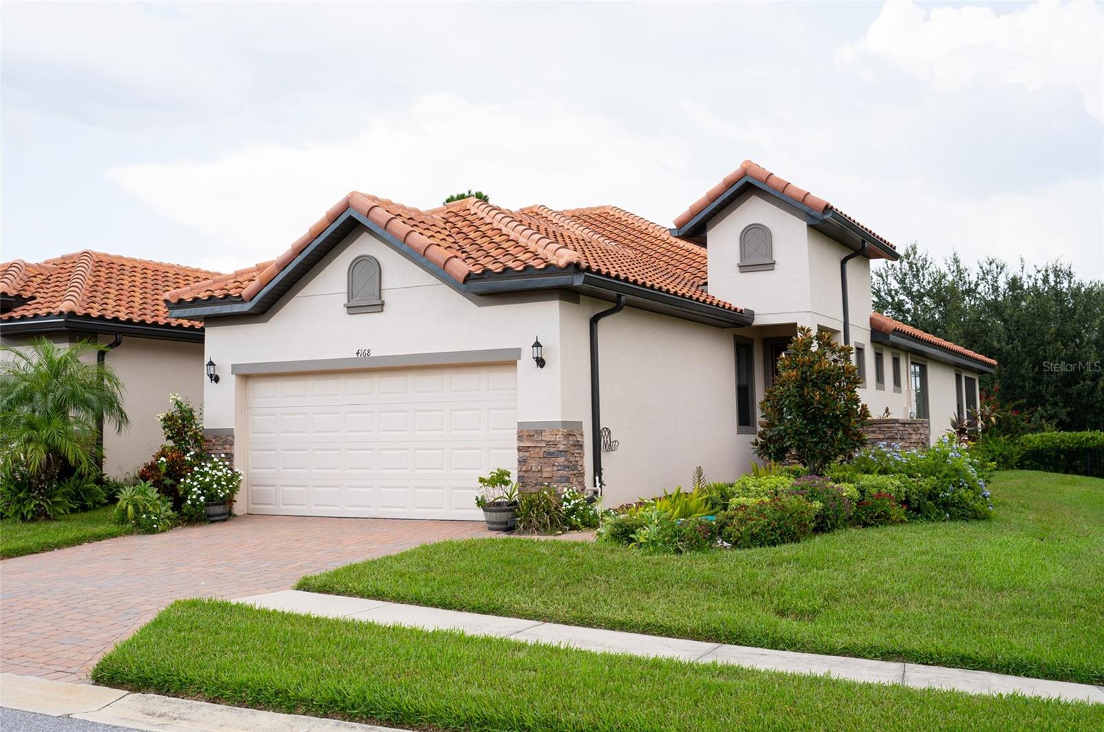 Welcome to this beautiful 3-bedroom, 2-bath home nestled in the highly sought-after Terralargo community in Lakeland, Florida! Perfectly situated on an elevated corner lot, this home offers both curb appeal and functionality. As you enter, you’ll find a charming flex space near the entryway—ideal for a mini garden, reading nook, or a personalized design to showcase your creativity. The modern kitchen is a chef’s delight, featuring a spacious quartz countertop, stylish backsplash, and upgraded tall cabinets that provide both elegance and ample storage.
The home’s open layout flows into a welcoming great room that seamlessly combines dining and family living. A sliding glass door opens to a screened, covered lanai, perfect for enjoying Florida’s beautiful weather year-round.
Terralargo is known for its resort-style amenities, including a clubhouse, fitness center, pool, tennis courts, and scenic walking trails—all just minutes from shopping, dining, and major highways. Enjoy maintenance free living! HOA includes lawn maintenance, cable and internet services.Don’t miss this opportunity to make this stunning home your own!