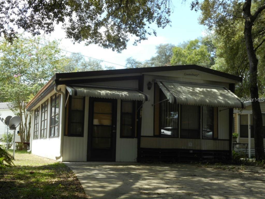 You own the land!! 1 bedroom 1 bath park model with enclosed Florida room. Natural light with vinyl windows. Inside you will find lots of cabinet space, open kitchen with built in cabinet space throughout and washer/dryer hook-ups. On the exterior you will find a low maintenance yard, paved parking for 2, shade trees and utility shed. The monthly Condo fees included water, sewer, trash pickup virtual gatehouse, 110,000-gallon Pool, On-Site Condo Office and Management, maintenance of community grounds. Pay condo dues and metered electric bill for a prime location in sunny central Florida! Our location is very convenient with lots of dining, hospital and shopping close by. Prime location in central Florida, No lot rent. New A/C November 2023. Attractive for investor with long term Tenant in place.