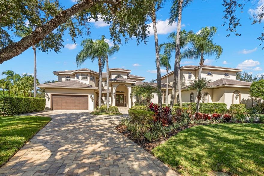 Under contract-accepting backup offers. Not Just a Home — An Heirloom in the Making This spectacular 5,900 SF Alvarez-built custom estate is situated on two full lots at the end of a private cul-de-sac in the prestigious gated community of Bayou Club Estates. Overlooking the 6th and 7th greens of the Bayou Club Golf Course, this home offers the perfect blend of elegance, privacy, and modern updates, making it ideal for both entertaining and multigenerational living. Recently refreshed from top to bottom, the home features a brand new tile roof (Oct 2024), a stunning gourmet kitchen with white shaker panel cabinetry, a contrasting statement island, Wolf induction cooktop, built-in Wolf ovens, Sub-Zero refrigerator, and gorgeous quartz countertops. The kitchen flows seamlessly into the family room, highlighted by a marble fireplace and tray ceilings with inset lighting, creating a warm yet sophisticated ambiance. The thoughtful floor plan offers 5 bedrooms, 3.5 bathrooms, a 3+ car garage, and a separate guest house wing, perfectly designed for extended family or visitors. Upstairs, the expansive in-law suite (29x25) includes a kitchenette, bathroom, and oversized walk-in closet. Additional living spaces include a huge 29x17 bonus room—ideal for a playroom, office, or den—and a state-of-the-art media room (22x17) for private screenings or game nights. The primary suite is a luxurious retreat featuring tray ceilings, a spa-inspired bath with dual quartz vanities, Jacuzzi tub, separate shower, and an expansive custom walk-in closet. All secondary bedrooms are generously sized, with abundant natural light and custom closets. Outdoor living shines with a remodeled pool area and summer kitchen, perfect for al fresco dining and entertaining year-round. Mature landscaping, a spacious courtyard between the guest wing and main house, and sweeping golf course views provide both serenity and exclusivity. This rare offering combines scale, privacy, and craftsmanship in one of Tampa Bay’s most sought-after gated communities—an estate that is both timeless and move-in ready.