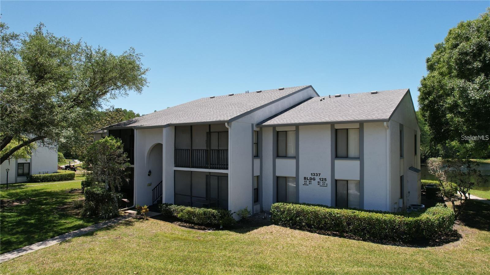 Prime location in a highly sought-after maintenance-free community! This 2-bedroom, 2-bathroom top-floor end-unit condo is nestled in the desirable East Lake area. The seller is the original owner, and the property has been lightly lived in, only occupied seasonally for 6 months out of the year. The unit features brand-new carpet throughout, with updated linoleum flooring in the kitchen and bathrooms. Step out onto your lanai, which now boasts new outdoor carpeting, perfect for relaxing. Additional updates include new lighting fixtures in the bathrooms for a fresh touch. Enjoy the convenience of a spacious walk-in laundry room with shelving and hookups for a full-size washer and dryer. The master suite offers a private bath with a walk-in shower and a walk-in closet complete with attic access for added storage. The screened lanai, accessible from the living room via sliding glass doors, is ideal for enjoying your morning coffee or unwinding in the evening. This upscale community offers resort-style amenities including a heated pool, spa, clubhouse, tennis court, BBQ grills, and scenic walking and biking paths, all just steps away. Conveniently located near the famous Sponge Docks, gulf beaches, shopping, restaurants, golf courses, and parks. Don’t miss this opportunity—schedule your private tour today!