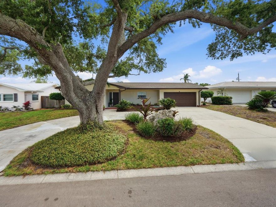 Welcome to this pristine fully updated four bedroom pool home. This gorgeous property is a must see starting with its great location, high on the Bluff in the much sought after Harbor Hills Subdivision! From the elevated shady lot complete with circular drive and manicured lawn to the incredible two way split plan and sparkling pool, this one should definitely be top of your list to see! As you enter the house you will immediately appreciate the open and very tastefully designed layout. The front facing, two tone galley kitchen offers all the conveniences any chef could ever ask for, yet it's designed in such a way that it is the crowning jewel for the open living space offering tall cabinetry, stainless appliances, marble counters and an oversized Island with ample seating for casual dining.The formal dining area comfortably offers plenty of space for even the largest dining room furniture and is the perfect place to entertain. The bright and airy Living room is located at the back of the home, with double french doors beckoning you to step outside to sparkling tropical pool and private backyard beyond. The crowning glory is the tasteful architectural coving which somewhat defines the living space and adds to the ambiance of this incredible room! The Primary suite is tucked away in the back of the house and features an oversized closet, fully upgraded bathroom with a floating vanity, double sinks and an incredible step in shower featuring clear glass entry crowned with tasteful fixtures and fittings. The second and third bedrooms share a stylish guest bathroom with a tub with clear glass doors. This one doubles as a pool bath! The fourth bedroom is tucked in the back of the house, overlooking the pool and would make a perfect home office, craft room or a home gym! The Washer & Dryer closet is conveniently located inside the home and offers quality appliances. The beautiful pool area is the perfect place for entertaining with an oversized paver patio and the low maintenance yard is ready for those who have green fingers! Don't delay in seeing this quality home as it is priced competitively and will sell fast!