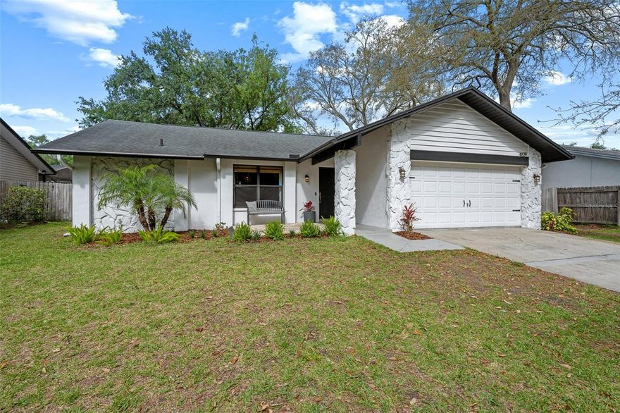 It has been years since a truly move-in-ready home has sold in the highly sought-after Lake Valencia neighborhood for under $500,000. Thoughtfully updated and filled with warmth, character, and flexibility, this residence offers a rare opportunity to secure a home that balances lifestyle, comfort, and long-term value in one of Palm Harbor’s most desirable established communities.

From the moment you enter, the home welcomes you with a bright, inviting atmosphere and a layout designed for comfortable daily living and easy entertaining. The main living spaces flow naturally together, creating a sense of openness without sacrificing charm. Natural light filters throughout, highlighting the home’s comfortable proportions and livable design. The kitchen delivers a clean, modern aesthetic with striking contrast and thoughtful design. Custom black cabinetry, warm brass hardware, and light quartz countertops create a look that feels both refined and approachable. A central skylight fills the space with natural light throughout the day, while the oversized peninsula offers the perfect setting for meal prep, casual dining, or gathering with guests. Details like the farmhouse-style sink framed by a picture window and open wood shelving add warmth, character, and a custom designer feel. Seamlessly connected to the main living areas, this kitchen is as functional as it is stylish and designed to support everyday living and effortless entertaining. The primary suite offers a true retreat feel with generous bedroom space and a spa-inspired en suite bath featuring rich finishes, warm textures, and a calming aesthetic. Secondary bedrooms are well-sized and versatile, offering flexibility for guests, children, home office use, or evolving household needs. One of the most compelling features of the home is the expansive bonus room, currently featured as a fourth bedroom but best suited as a secondary living room, media lounge, game room, playroom, creative studio, or multi-purpose flex space. Complete with a wood-burning fireplace, built-in shelving, and backyard views, it creates a cozy yet highly functional extension of the home that can adapt to a wide range of lifestyles. The laundry room has also been thoughtfully improved and offers more than just utility, with stylish finishes, additional cabinetry, and a clean, well-designed feel that enhances daily functionality. Outside, the backyard offers a rare combination of scale, privacy, and possibility. Framed by mature trees and generous open yard space, it provides immediate enjoyment while also serving as a large blank canvas ready to be customized around your vision. Whether you envision a future pool, expanded patio, garden retreat, outdoor kitchen, fire pit lounge, play space, more curated landscape design, the setting is ready for your touches. 
Located in Flood Zone X, flood insurance is not required, offering added peace of mind. The home is also zoned for A-rated Lake St. George one of the area’s most sought-after school zones. Enjoy proximity to shopping like Target, Publix, restaurants, coffee shops, and specialty retail. Outdoor enthusiasts will appreciate being near Lake Tarpon, local parks, and recreational amenities, while commuters benefit from easy access to major roads connecting you to all of Tampa Bay, top-rated beaches, and Tampa International Airport. Homes offering this level of condition, flexibility, and location at this price point are increasingly difficult to find.