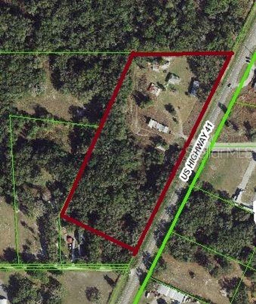 Great commercial opportunity! With almost 1000 front feet on US Highway 41 this expansive  8.13 acre tract is a real attention grabber!  With a combination Zoning of C-2 & AC this tract is ripe for development with nearby commercial & residential projects underway. While the value of this parcel is in the land this property has an existing shop, storage buildings, small home & is partially fence. Conveniently located minutes from the Suncoast Expressway & SR 52. Buyer to confirm all information & perform their own due diligence. Shown by appointment only, do not disturb tenant.