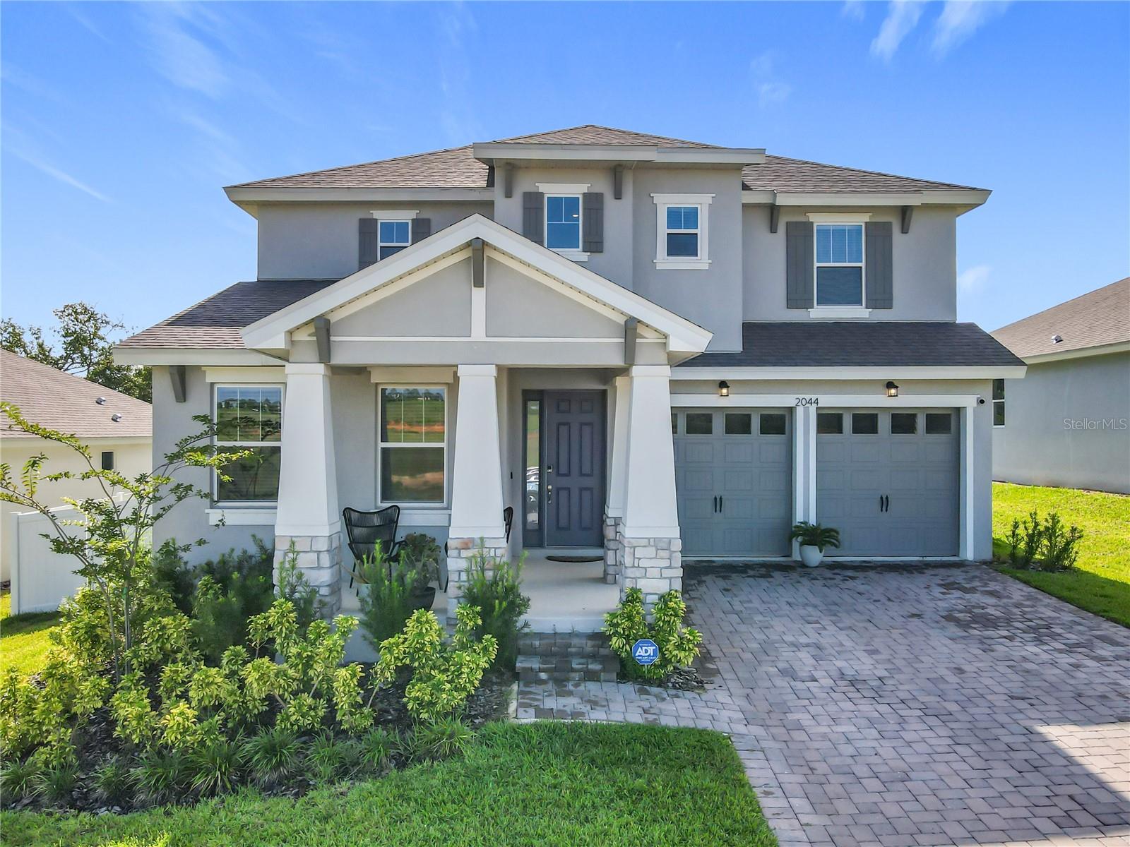 Welcome to this beautifully upgraded 4-bedroom, 3-bathroom Biscayne model home built in 2023 by Dream Finders Homes, located in the highly sought-after Hills of Minneola community. Situated on a 0.20-acre lot with no front or rear neighbors, this home offers the perfect combination of privacy and comfort.
Inside, you'll find a bright foyer leading to a flex room with a walk-in closet—ideal for a home office. The gourmet kitchen features quartz countertops, an oversized island with modern lighting, built-in oven and microwave, cooktop with stainless steel hood, stylish backsplash, and gold hardware. A large walk-in pantry provides ample storage.
The open-concept dining and living room area includes a modern electric fireplace. Upstairs, enjoy a spacious loft, dedicated laundry room with cabinetry, and all bedrooms with walk-in closets and plush carpet. The primary suite offers dual sinks and an oversized walk-in shower.
Additional highlights include a covered rear patio overlooking a fully fenced backyard, a two-car garage with durable Shark Coating floor finish, and tasteful upgrades throughout. Community amenities include a resort-style pool, parks, playgrounds, and clubhouse. Conveniently located near top-rated schools, the new Advent Healt hospital, and with easy access to the Florida Turnpike. Approximately 25 minutes from Disney and 30 minutes from Orlando International Airport.