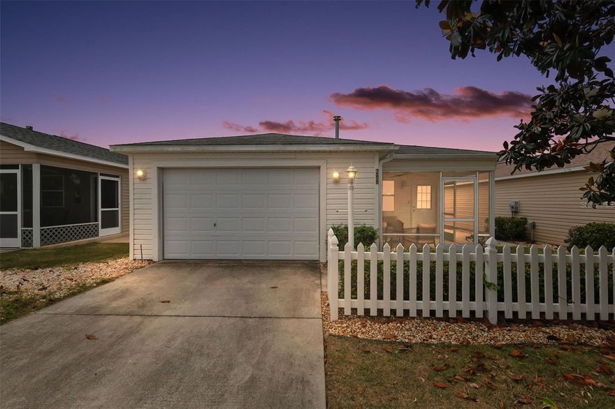 FANTASTIC, TURNKEY 2/2 Colony Patio Villa featuring SCREENED LANAI and an INTERIOR LAUNDRY nestled in the Katherine Villages of the highly sought after Village of Caroline - JUST MINUTES to LAKE SUMTER LANDING with live nightly entertainment and “between the 6’s” for all of your shopping and dining needs! LOW BOND - only $3,405.42! MOVE-IN READY - Just bring your suitcase! As you approach this WONDERFUL home, you can’t help but notice the CHARMING white picket fence and LOW-MAINTENANCE STONED landscaping beds. Step into the SCREENED LANAI featuring a ceiling fan and PAINTED floor creating the PERFECT spot to RELAX with your morning coffee, evening cocktail, or a good book! Enter through the front French door into the OPEN CONCEPT layout of the living, dining, and kitchen. Throughout the home, you will find RICH, WOOD-GRAIN LUXURY VINYL PLANK - NO CARPET! The SPACIOUS main living area offers a large window and a set of sliding glass doors for ABUNDANT NATURAL LIGHT. The kitchen is a chef’s delight showcasing WOOD cabinetry with PULL-OUTS, NEUTRAL countertops, PANTRY closet, and an EAT-IN breakfast bar. The primary suite boasts a GENEROUS WALK-IN closet and a well-appointed en-suite bathroom with WOOD cabinetry, NEUTRAL countertop, and a WALK-IN shower. Bedroom two offers a built-in closet, while the second bathroom features a WOOD vanity with NEUTRAL top, tub and shower combination, and a hallway LINEN closet. A CONVENIENT, INTERIOR LAUNDRY closet offers additional shelving for EXTRA STORAGE needs. Completing the package is an 18’x22’ one and a half car garage with a UTILITY SINK and PLENTY of space for a car and golf cart! DON’T MISS YOUR OPPORTUNITY TO MAKE THIS WONDERFUL HOME YOUR OWN! The Village of Caroline is ONLY MINUTES from Lake Sumter Landing - where you’ll find an array of shopping, dining, and  live nightly entertainment! You’ll also be close to Mallory Hill and Arnold Palmer Country Clubs and Championship Golf Courses. Health enthusiasts will love the proximity to the Lake Miona Regional Recreation Center and Fitness Trail. Also nearby to Coconut Cove Recreation Center; Caroline Neighborhood Pool; additional recreation centers, golf, pickle ball, swimming pools, and more! PLEASE WATCH OUR WALKTHROUGH VIDEO of this INCREDIBLE HOME in an AMAZING LOCATION and call today to schedule your Private Showing or Virtual Tour!