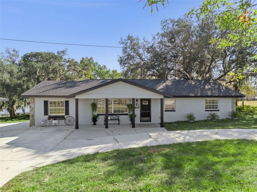 Country Freedom Meets Modern Renovation:  

If you’ve been searching for a beautifully renovated home with land, room to breathe, room to build, and zero HOA telling you what you can’t do, this is the one you’ll want to see first.

Set on peaceful acreage just minutes from The Villages, this fully updated 4-bedroom, 3-bath home gives you the rare combination of modern finishes, functional outbuildings, and a true country-living feel, all while keeping you close to everything. Roof & AC: 2025

Step inside and you’ll immediately notice the thoughtful renovation. The entire home features brand-new wood-look tile flooring—durable, stylish, and perfect for country living. Fresh interior and exterior paint brings a clean, crisp look throughout. The heart of the home is the newly redesigned kitchen, complete with all-new cabinetry, quartz countertops, and modern appliances—a space that feels custom-built and ready for big meals, gatherings, and everyday comfort.

But the magic of this property extends well beyond the walls.

Out back sits a three-car barn/workshop, designed for serious hobbyists, equestrians, small-business owners, or anyone who simply wants a place to create, store, or build. With its own tack room and bathroom, it’s a dream setup. The property also includes two free-standing stalls plus two additional stalls attached to the rear of the barn, offering flexible options for horses, goats, or your future homestead animals.

Need extra storage or parking? You’ll have a 1-car garage, carport, and a separate enclosed storage area—space for tools, toys, tractors, or whatever lifestyle you choose to live.

***This property is full of potential:
A small homestead? Easy...
A workshop or hobby space? Already built...
A place to bring your animals? Stall-ready...
A home where you’re not restricted by an HOA? Finally...***

And best of all: you get the peace and privacy of the countryside without sacrificing access. You’re just minutes from The Villages, giving you top-tier convenience with the feeling of being worlds away.