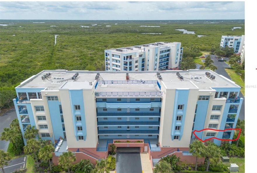 ******COMING SOON. THE HOME WILL BE AVAILABLE TO START SHOWING ON MONDAY, OCTOBER 13, 2025******

Welcome to Ocean Walk Condominiums, a resort-style, gated community in beautiful New Smyrna Beach. This spacious 2nd-floor corner unit (with a rare 3rd patio/balcony) offers 3 bedrooms, 2 bathrooms, and 1,768 sq. ft. of comfortable coastal living—perfect as a full-time residence, vacation home, or a short-term rental investment option*****

Offered as move-in ready, the condo features an open, light-filled floor plan with LVP throughout. The gourmet kitchen is equipped with all white appliances, abundant cabinetry, pantry, and breakfast bar seating, all opening seamlessly to the living and dining areas—ideal for everyday living or entertaining*****

The bright primary suite includes access to a private balcony, plus a spa-style bathroom with dual vanities, walk-in shower, and a jetted soaking tub. Two additional bedrooms and a full bath provide plenty of space for family and guests. A separate laundry room with washer and dryer, private storage closet on the same floor, and under-building parking add convenience*****

Enjoy three private balconies where you can relax with ocean breezes and partial views of the Atlantic. Hurricane-rated sliders fill the condo with natural light while ensuring peace of mind*****

Ocean Walk offers resort-style amenities, including:

Two clubhouses with kitchens and entertainment spaces

Two heated pools & spas

Fitness center, nature trails

Tennis, pickleball, basketball & shuffleboard courts

BBQ grills, and private deeded beach access to the car-free beach*****

The community is pet-friendly, gated, and professionally managed. Building 14 is one of the most desirable, with close proximity to the newer clubhouse, pool, fitness center, and beach access. Recently repainted, this building is well maintained so you can simply relax and enjoy*****

All of this is just 5 minutes from Flagler Avenue’s shops, dining, art festivals, and live music. Don’t miss your chance to experience the Florida lifestyle in one of New Smyrna Beach’s most sought-after communities—schedule your private showing today!