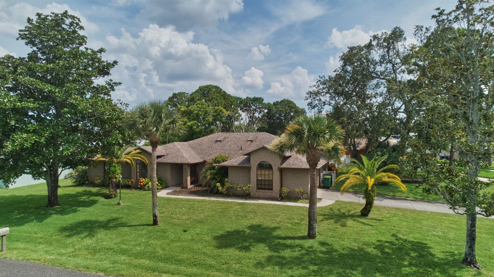 This 4-beds/2-baths concrete block home offers the comfort and convenience you've been looking for without HOA.
Upon entry, there's a formal living room and study which doubles as a bedroom. Kitchen is open to the family room and equipped with stainless steel appliances, including a new refrigerator, a reverse osmosis filtration system and offers plenty of prep and storage space. Just off the kitchen is a formal dining room area.
All bedrooms are spacious and the master suite features a walk-in closet and a luxurious bathroom with a shower and spa tub, perfect for relaxing after a long day. The second bathroom is wheelchair accessible.
Step outside to your screened-in porch, ideal for morning coffee or evening breezes. Yard includes mature oak tree, fig tree and beautiful magnolia trees.
Located less than 2 mins from the river, it's close to grocery stores, restaurants, gym, and pharmacy. You'll love the convenience this home provides while enjoying rocket launches from your own yard