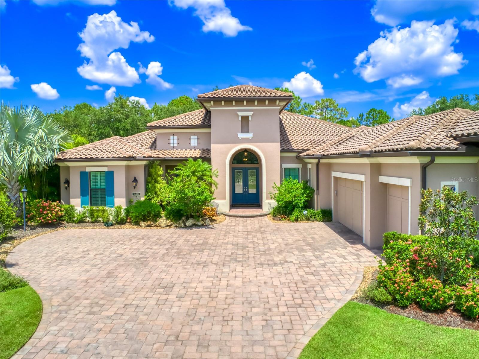 Enjoy a consummate experience in refined living at The Concession, an exclusive, Guard-Gated Community featuring a nationally-acclaimed Golf Club, set in a natural environment of majestic 250-year old live oaks, natural wetlands and a variety of wildlife. Approaching this elegant home, a long Paver Driveway leads to a Koi Pond & Water Feature at the entrance. Custom Double Doors provide entry. You are greeted with an impressive panoramic view of the outdoor spaces and lush vegetation, via a rear wall of tall sliding doors. This tasteful, custom-built Lee Wetherington home boasts an Open Concept Floor Plan, palatial 13' Ceilings, 8’ Doors, Large Windows and a myriad of Custom Features. The expansive and sunlit Great Room offers flexible space to create comfortable Living and Dining areas. The Chef’s Kitchen features a grand Center Island, cooking Prep Sink, Gas Stove, Pot Filler faucet, custom Wood Cabinets, Granite Counters, custom Lighting and Tile Backsplash. The Walk-In Pantry offers generous storage space. Wine enthusiasts will enjoy a separate Room featuring a Wine Refrigerator & Storage. Private luxury awaits in the Elegant Master Suite Retreat. French Doors provide access to the Lanai and a Sitting Area offers space for reading or unwinding. A luxurious en-suite Bathroom features a double-sided large glass walk-in Shower with body jets, rain shower and body wand as well as a Soaking Tub, Dual Sinks, Custom Wood Cabinetry and Granite Counters. Large, Dual Custom Walk-In Closets provide ample space for wardrobes. The impressive executive Office/Den boasts engineered wood floors, book shelves, desk and access to the Lanai. The expansive screened Lanai creates an Outdoor Sanctuary - offering both covered & open living and dining areas, surrounded by the privacy of a nature preserve. Designed with pavers, recessed lights & fans - this is the ideal space to enjoy a Florida Indoor-Outdoor Lifestyle. The heated Pool features water falls, a sun shelf & space to relax in the sun. Warm up on chilly evenings gathered around the Fire Pit, prepare meals all year in the Outdoor Summer Kitchen fully-equipped with a hooded grill, refrigerator, sink and storage space. Sip morning coffee in the sun or casually dine under the stars. This home is designed to afford maximum comfort and privacy. For convenience, a 4th Pool Bathroom with a step-in Shower is accessed via the back door to the Lanai. Two additional Bedrooms with En-Suite Bathrooms are located in a separate wing. At the end of the hallway leading to the 3-Car Garage, the large Laundry Room features storage Cabinets, Closets, Sink and Counters. Bonus features - Certified Florida Green Home, Irrigation Well, Whole-House Generator, Hurricane Rated Windows & Doors, Central Vacuum System, built-in Sound System and Tankless Gas Hot Water Heater. The Concession is a short drive to nationally-acclaimed beaches, shopping at the UTC Mall, fine dining restaurants, medical facilities, airports, sports activities, art, culture and entertainment. Award-Winning and Distinctive -The Concession 18-hole championship Golf Course is considered one of Florida’s best private courses. Designed by Jack Nicklaus & Tony Jacklin in honor of the 1969 Ryder Cup, the course hosted the 2021 World Golf Championship and the inaugural 2023 World Champions Cup, set to repeat in 2024, 2025 and 2028. Live your Dream - Experience an exceptional life in a luxurious home - located in a world-class golf community - The Concession!