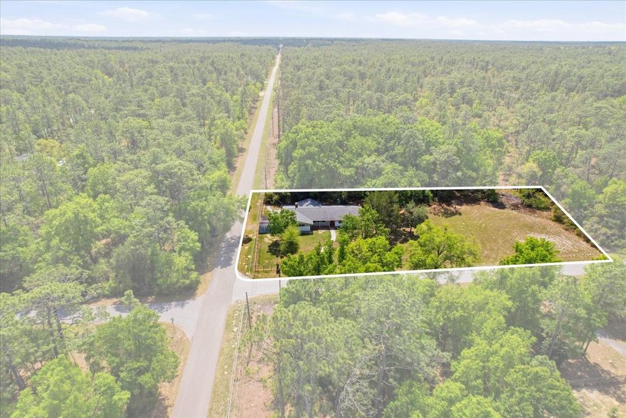 * CLICK 3D TOUR UNDER FIRST PIC* $DEAL ALERT$ 5 BED 2.5 BATH MULTI-GENERATIONAL HOME AT MARKET AVG PRICE at 175.00 A SQ/FT. Well-maintained 5-bedroom, 2.5-bath home offering flexibility, space, and recent system updates on approximately one acre across two parcels in Rainbow Lakes Estates. Notable improvements include a roof replacement in 2021, energy-efficient double-hung windows installed in 2021, and a 3.5-ton 14-SEER HVAC system also updated in 2021. The home is on .5 of the acre, & is fenced and shaded by mature oak trees. The adjacent cleared half-acre includes a newer well and offers future potential, (RV water & electric hookups) & for permitted improvements such as additional storage, RV accommodation, workshop, or garage (only county permits required). Ample on-site parking provides convenience for multiple vehicles. Located within 25 mins. drive of Rainbow & Withlacoochee rivers, Gulf Coast beaches, and Central Florida attractions, this property combines functionality with access to Florida’s outdoor lifestyle. Residents enjoy access to Rainbow Lakes Estates amenities, including a community park, center, and lake access with scenic views. PUT YOUR CRACKLIN FIRE PIT ON CLEARED .5AC AND GAZE UP AT BIG SKY VIEW OF A BILLION STARS AMIDST THE COOL EVENING BREEZES. 11 PARKING SPOTS ALONG BORDER OF HOME FOR BIG FAMILY GATHERING OR RIVER TUBING, BOATING, KAYAKING OR SWIMMING (25-30 MINUTES TO RIVER PARKS). CRYSTAL RIVER BEACH TRIPS (35 MINS) OR FAMILY EXPEDTION TO DISNEY (1.5 HRS), CEDAR KEY PUBLIC BLONDE SAND BEACH, & FISHING PIER INCLUDES FLORIDA ORANGE SUNSETS. YOUR RAINBOW LAKES ESTATES COMMUNITY FEATURES BIG FAMILY PARK, COMMUNITY CENTER WITH FREE PIER RESIDENTS ACCESS TO VIEW SUNSETS OVER SCENIC SPARKLING BLUE LAKE BONABLE. YOUTH ACTIVITY CENTER AND FAMILY LIBRARY.  CONVIENENCES OF SHOPPING, WATERFRONT DINING, MEDICAL OFFICES, HOSPITALS, ENTERTAIMNET NEARBY IN OCALA, CRYSTAL RIVER AND INVERNESS. YEAR ROUND WORLD EQUESTRION CENTER, EVENTS AND CELEBRATIONS WITHIN 30 MINS. COME HOME TO SUNNY FLORIDA FRESH AIR, SUNSHINE, NO STATE INCOME TAX * PHOTOS VIRTUALLY UN-STAGED TO REMOVE FURNITURE, * Ai utilized to enhance and/or translate descriptions. Spanish remarks may not be grammatically accurate.