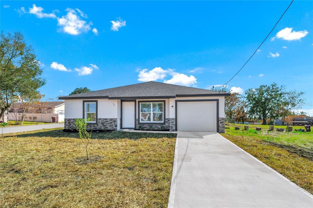 Photo of 701 Claude Holmes Sr Avenue, Haines City, FL 33844 (MLS # O6385678)