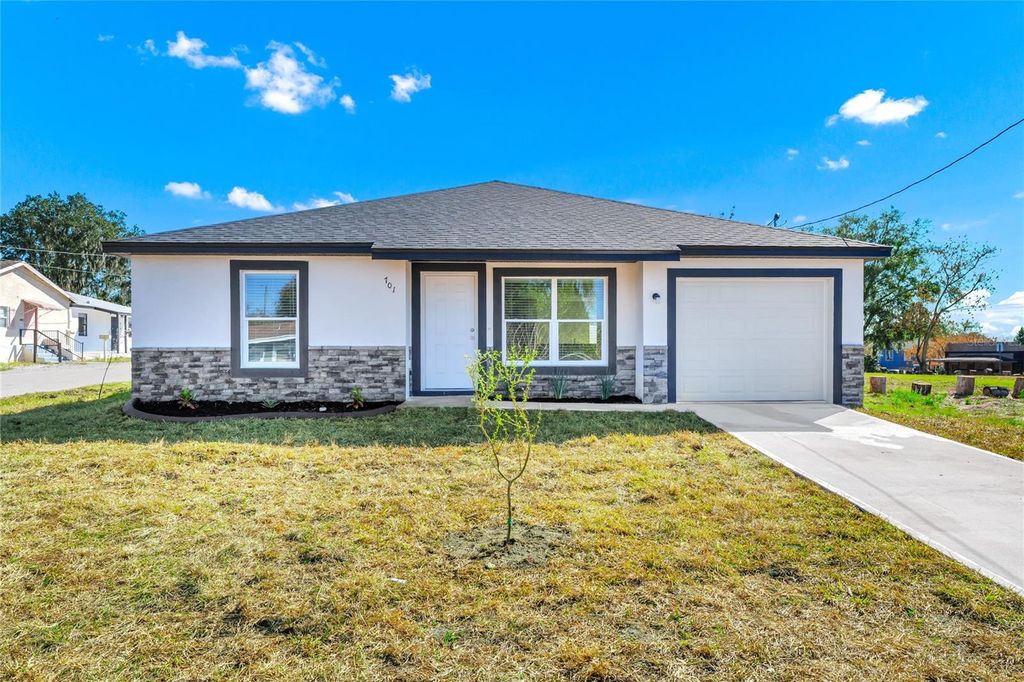 Photo of 701 Claude Holmes Sr Avenue, Haines City, FL 33844 (MLS # O6385678)