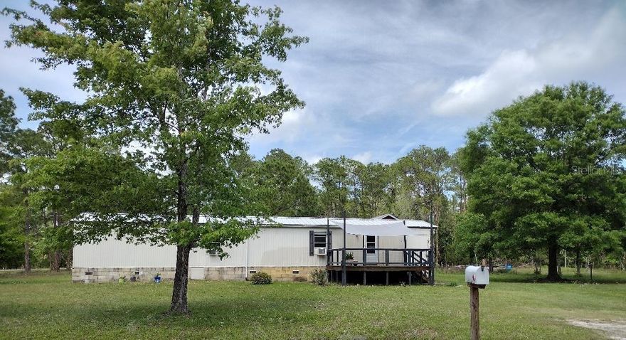 Charming 2-bedroom, 1-bath singlewide situated on a spacious 275’ x 180’ corner country lot, offering privacy and room to enjoy the outdoors. This well-maintained home features a comfortable family room, mud room entry, and an eat-in kitchen with gas stove—perfect for everyday living.

Recent updates include a beautifully renovated bathroom (2022), new hot water heater (2024), and durable tile plus water-resistant laminate flooring throughout. Enjoy relaxing mornings and evenings on the front and back decks, both with newer deck boards. A metal roof adds long-term durability and peace of mind.

The property also includes a picturesque pond and a versatile 2-story barn, ideal for storage, workshop space, or hobby use. Plenty of room for animals, gardening, or outdoor recreation—embrace peaceful country living while still being within reach of nearby amenities.