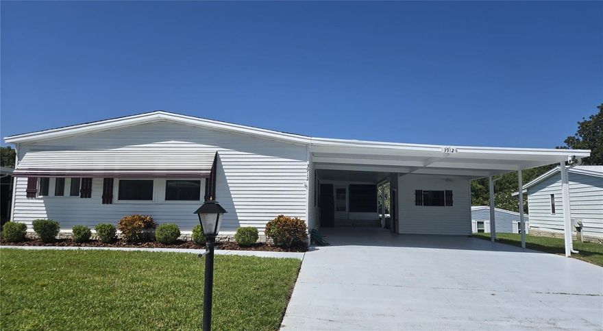 Nicely renovated 3-bedroom 2 bath home, Move in Ready!! 1874 sq feet. New vinyl plank flooring, both bathrooms renovated, granite countertops. Very large 3 car carport (FLAT driveway), indoor laundry. Seller is Motivated! ZELLWOOD STATION IS A RESIDENT OWNED 55+ GOLFING COMMUNITY located between Apopka and Mt Dora. We have a 72 Par golf course, 4 pools, pickleball and tennis courts; water exercise and line dancing classes and our own Whistle Stop Restaurant and Lounge with banquet facilities.  There is always something to do here.  Close to the 429 for easy access to airports and attractions, we are close to shopping, restaurants, medical facilities and churches.  Come and see what we have to offer!