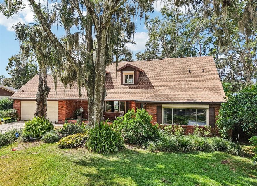 SPECTACULAR LAKE VIEWS!!!! Discover the magic of true LAKEFRONT LIVING with this beautifully updated home with 3-BEDROOMS, 3 FULL BATHROOMS + an OFFICE & an EXPANSIVE BONUS ROOM! It can be found NESTLED ALONG THE SHORES OF SPRING-FED LAKE VIRGINIA, one of the area's most sought-after chain of lakes. Imagine waking up to AMAZING WATER VIEWS, spending your afternoons boating or jet skiing right from your PRIVATE DOCK, and winding down under the stars with gentle lake breezes — this is Florida living at its finest.
Located in a quiet, scenic pocket of Lutz and directly across from pristine conservation land, this property offers a rare sense of seclusion and natural beauty — all with NO HOA OR CDD FEES to restrict your lifestyle. FLOOD INSURANCE IS NOT REQUIRED FOR THIS PROPERTY, and the CURRENT HOMEOWNERS INSURANCE PREMIUM IS EXCEPTIONALLY LOW AT ONLY $3000 ANNUALLY due to valuable discounts including major wind mitigation discounts for the hurricane rated garage door, shutters, etc!
Step inside and be welcomed by charm and comfort, from the ROCKING CHAIR FRONT PORCH to the expansive living spaces designed to bring the outdoors in. The charming, REMODELED KITCHEN OFFERS QUARTZ COUNTERTOPS, CRISP WHITE SHAKER CABINETRY, STAINLESS STEEL APPLIANCES, A LARGE ISLAND WITH SEATING, AND A COZY SITTING AREA WITH A WOOD-BURNING FIREPLACE — ALL OVERLOOKING THE SHIMMERING LAKE – this is truly the heart of the home.
The layout includes a spacious DOWNSTAIRS PRIMARY SUITE for ultimate convenience, while upstairs you'll find a truly special BONUS ROOM — A VAST, LIGHT-FILLED SPACE WITH WALL-TO-WALL WINDOWS FRAMING PANORAMIC VIEWS OF LAKE VIRGINIA. Whether used as a home office, art studio, second living room, game room, or movie room, this versatile space offers both inspiration and serenity, making it one of the most captivating features of the home. Wake up to sparkling water in the morning, enjoy brilliant sunsets in the evening, and let this room become your personal escape or creative retreat.
The home has been meticulously maintained with recent upgrades including HVAC SYSTEMS (2017 and 2023), a NEW HOT WATER HEATER (2023), a ROOF REPLACED IN 2017, and A COMPLETE RE-PLUMBING IN 2015. The ELECTRICAL PANEL WAS UPDATED IN 2023, and REMOTE-CONTROLLED HURRICANE SHUTTERS add extra peace of mind.
Step outside to enjoy lakefront living at its best with a PRIVATE DOCK, 84' CONCRETE SEAWALL, AND A CUSTOM-BUILT PERGOLA WITH ELECTRICITY and DURABLE TREX DECKING— perfect for entertaining or relaxing by the water. There's also power in place for an EV charger or generator, and a practical "lake shower" in the laundry room makes rinsing off after water activities easy.
Whether you're looking to boat, fish, or simply soak in the peaceful lake views, this one-of-a-kind home offers it all. Don’t miss your chance to own a piece of paradise in one of Lutz’s most sought-after lakefront communities.