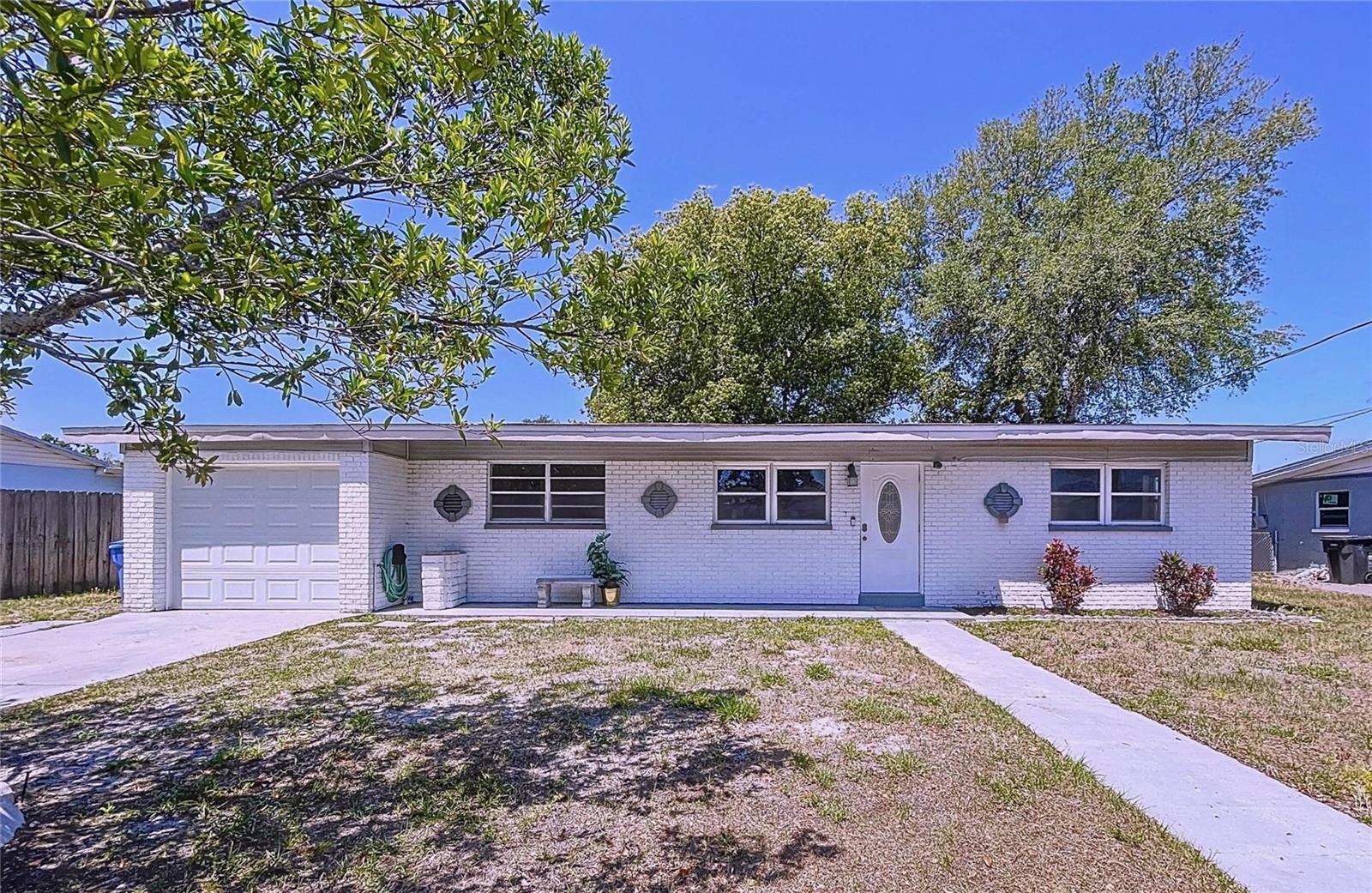 This is a gorgeous 3br/2ba/1gar waterfront canal home set in a quiet sidewalk neighborhood. You can fish right out of your backyard and live the Florida lifestyle. Canal leads to the bay/gulf so bring your boat! House is updated throughout including bathroom and kitchen with tile flooring, granite countertops, ceiling fans, lighting and fresh paint inside. Very secluded but conveniently located near Airport (5.5 miles), Publix groceries (0.6 miles), Rocky Point Golf Course (2.9 miles), our world famous beaches (29 miles), great schools, shopping and more. Solid block home, in a convenient location, schedule a showing soon!