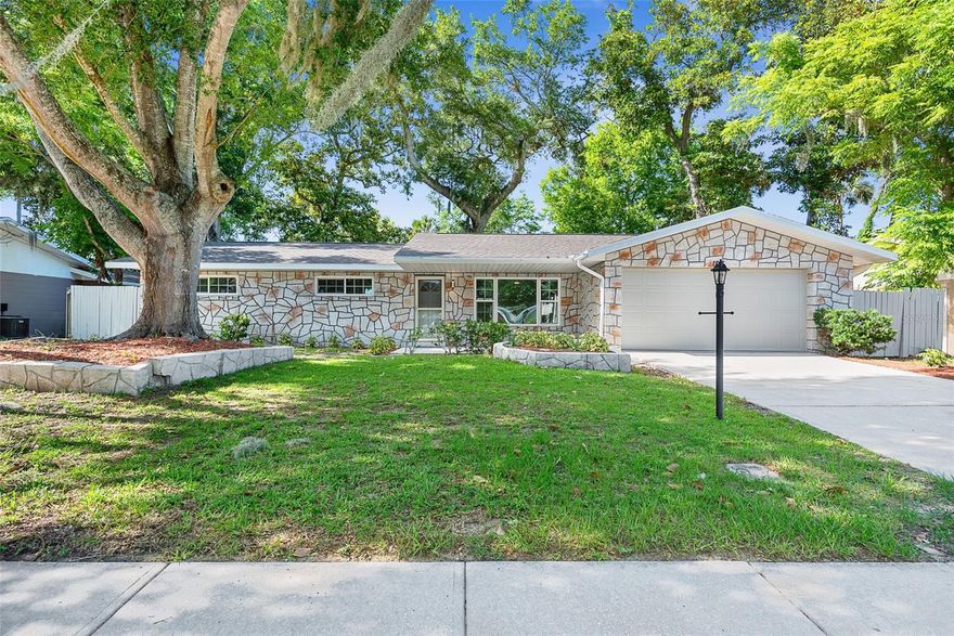 If you're looking for an affordable, turnkey home in Port Orange, you have found it! This 3 bedroom plus den property is loaded with updates including a brand new roof(April 2026), water heater 2024, and AC in 2020. Fresh paint inside AND out, including the deck, and epoxy on the garage floor really make this home stand out. The buyer of this home will enjoy a fully fenced backyard with mature trees. The remodeled kitchen is updated with solid surface countertops and newer stainless steel appliances, with the range being new in 2025. Both bathrooms also have recent remodels! All three bedrooms feature brand new luxury vinyl plank flooring with durable tile spanning the rest of the home. There are also new light fixtures and ceiling fans throughout!  Finally, with concrete block construction, rain gutters, and sitting comfortably in the desirable flood zone X, you will live with peace of mind for years to come.  Make sure to view the 3-D tour, and schedule your showing today!