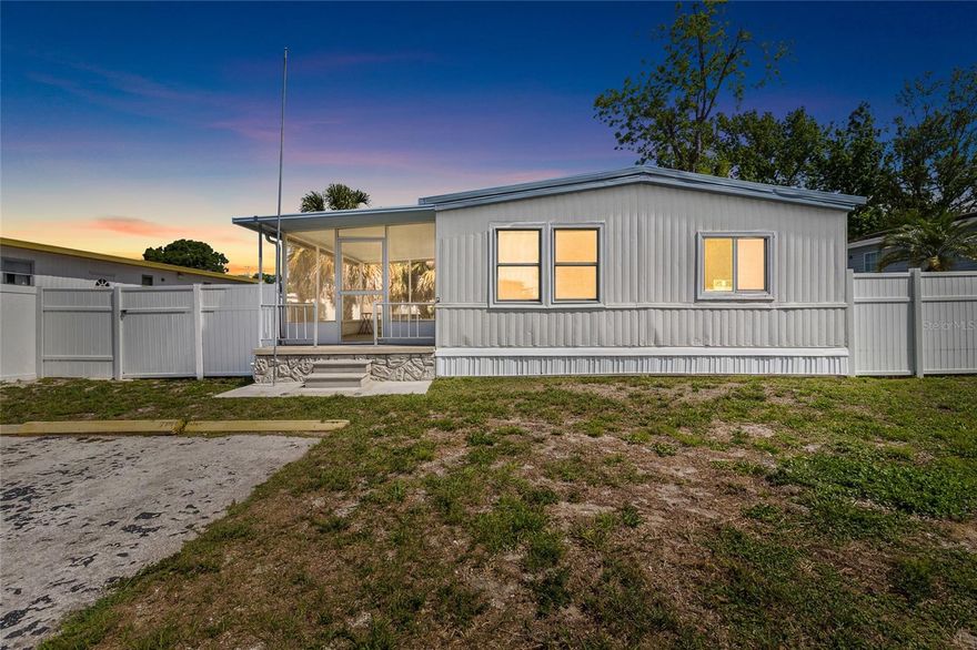 Homeownership awaits!! This fantastic manufactured home with many updates and upgrades is affordable and ready for you! No lot rent here! You own your own land! Bring your finishing touches to the remodeled home! From the subfloor to the dryway to the flooring the updates through the years are numerous! Updates include: the stunning white kitchen cabinets, gorgeous granite countertops, appliances, baths, windows, water heater, HVAC and more! A huge breezy screened lanai! A fenced yard and ample parking! Marble tile in the baths! The primary bedroom boasts an ensuite bath and sliders to the spacious backyard! The HOA fee is just 22 dollars a month and the community has a sparkling pool and clubhouse for events! All ages! Pet friendly! Affordability and convenience! The location is perfect! Close to shopping, schools, parks, restaurants with easy access to Tampa, St Pete and Clearwater beach! Own your own home and spacious lot! The kitchen is a chefs dream with tons of cabinets and counter space and a gorgeous Island with extra seating and entertaining space! Spacious lot! Room to Roam! Great buy! Great location! Great opportunity!