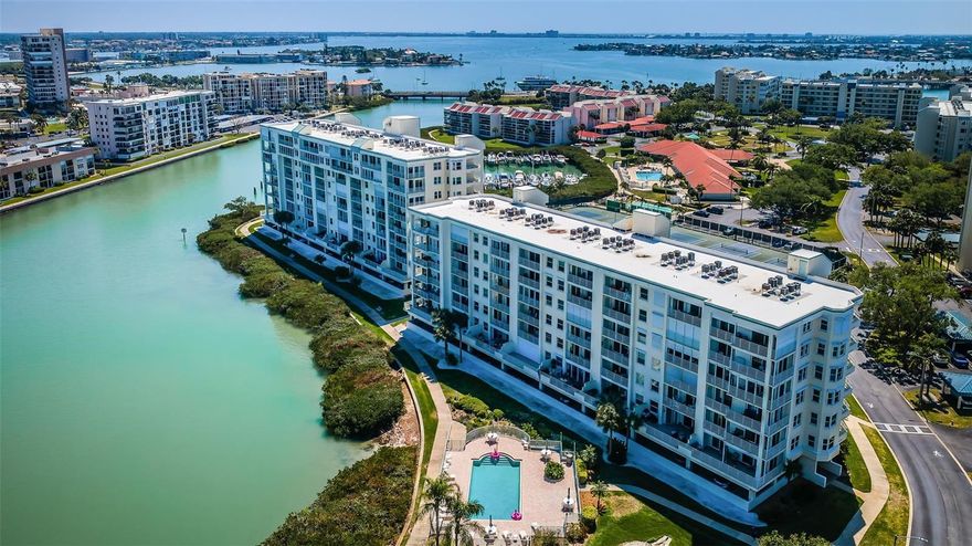 Live the Florida lifestyle at an exceptional value in Harbourside Resort!  This beautifully maintained, furnished 2-bedroom, 2-bath condo offers stunning views of Boca Ciega Bay and is your perfect gateway to Paradise. Located in the highly sought-after Harbourside gated community, this residence combines comfort, convenience, and resort-style living.  Inside, you’ll find a spacious, well-designed layout featuring an updated kitchen with elegant cabinetry, striking granite countertops, stainless steel appliances and abundant storage. Luxury vinyl plank flooring flows throughout most of the home, adding a modern touch. The split-bedroom floor plan ensures privacy for guests, while both the main living area and primary suite open to a generous 15-foot balcony—ideal for relaxing and taking in breathtaking water views, marine life, and coastal bird activity.  Additional highlights include in-unit laundry, assigned covered parking (#152), and convenient same-floor storage. The Sunrise Building  #11 features a new roof (2024) and benefits from low HOA fees.  Harbourside is a true waterfront oasis, surrounded by Boca Ciega Bay and designed for an active, coastal lifestyle. Residents enjoy a 1.5-mile waterfront walking trail, 86-slip full-service marina (slips may be available for sale or lease), fishing pier, and kayak storage—perfect for boating and nature enthusiasts alike.  Resort-style amenities include a beautiful clubhouse with a large room for social gatherings and events, billiards, library, card and craft rooms, his and hers fitness centers with saunas, and heated pool & spa.  In addition, there are 5 tennis courts, 2 pickleball courts, shuffleboard, multiple pools throughout the community, kayak storage, 24-hour guard-gated scurity, EV charging stations, car washing areas, picnic areas with grills and more!   The Sunrise complex residents also enjoy their own private pool.  Ideally located just minutes from the beaches, Corey Avenue, and vibrant downtown St. Petersburg—home to acclaimed dining, breweries, museums, and art galleries—and within 30 minutes of two international airports.  Pet-friendly with 3-month minimum rentals allowed, this is an outstanding opportunity for a primary residence or seasonal retreat.  Don’t miss your chance to own a slice of waterfront paradise and live the Florida lifestyle to the fullest!