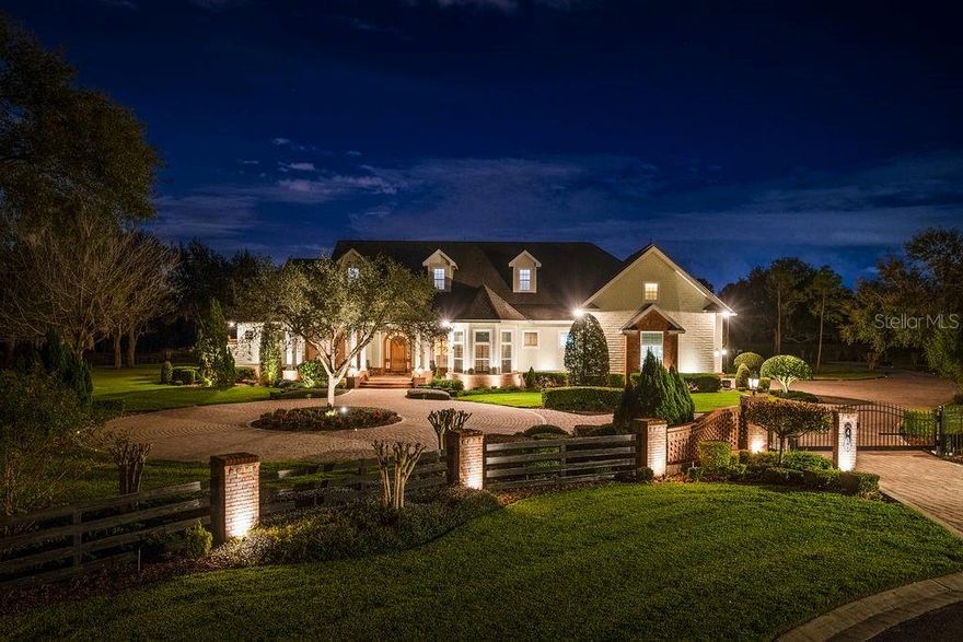 Welcome to the impressive estate of 400 Canterwood. As soon as you come in through your private community and private estate gate, you are transported to another world of luxury and quality. Walking through your custom mahogany front door, you are welcomed into the grand foyer with its opulent features such as solid hardwood flooring with its mosaic design, 12 to 18-foot high tray ceilings with custom crown molding, custom built-in bookshelves, and a direct view into your backyard oasis. Continuing through the home, you arrive at the custom gourmet kitchen that features granite countertops, 42” cabinets with slow close cabinetry, Thermador stainless steel appliances, a gas range cooktop, glass backsplash, under cabinet lighting, an impressive walk-in pantry, an enormous kitchen island with its cookbook shelf, a vegetable sink and a bar seating area- truly making this kitchen a chef’s paradise and an entertaining hub. With its split floor plan, the primary suite is on one wing of the property providing you maximum privacy. The primary suite incorporates an entrance foyer, tray ceilings, built-in shelving, crown molding, a plethora of windows providing natural light, an electric-powered fireplace, and private access to your backyard oasis. The primary bath is sure to impress with its beautiful marble flooring, high ceilings, double sink vanity, and a “princess” jacuzzi jetted tub with views to your private courtyard, allowing you to unwind from the everyday routine. This estate also features two additional bedrooms in the main home and a fourth detached bedroom perfect for a home office or an in-law suite. Movie lovers can take advantage of your in-home movie theater equipped with a 96-inch screen with a Sony high-definition projector, seven electric reclining seats, and a generous wet bar, allowing you to serve amazing snacks while viewing movies under your starlight ceiling. If this was still not enough, this estate features an additional detached structure that houses on the first level your additional eight-car garage, perfect for car enthusiasts, a tool room, and two car lifts. On your second level, accessed through your private elevator, you have an additional two-bedroom one-bath suite, with an enormous 20 by 40-foot craft room/bonus room perfect for gatherings, entertaining, or anything your heart desires! An additional full kitchen adorns this area with features such as GE profile appliances, a multitude of cabinetry for storage, and an enormous eat-in area! All of this under a tongue and grooved pine ceiling and interior walls, giving you the feeling you are in a beautiful cabin home in the mountains! Once done inside, it is time to go outside and enjoy the Florida lifestyle! Encompassing roughly 4.31 acres, you and your family will be able to enjoy the great outdoors in your own privacy. On the grounds of this estate, you also have your private 70-panel mounted solar farm, which in conjunction with your double insulated roof, helps with keeping your electric bills lower. The Florida lifestyle would not be complete without your private pool oasis with a beach-style entrance, a 12-person heated spa, and your personal rock accent waterslide. To top it all off you cannot be in a better location with easy access to the major highways, in between both Tampa and Orlando, and minutes away from retail shops and developments. All that is missing in this grand estate is you! Contact your realtor today for an exclusive showing.