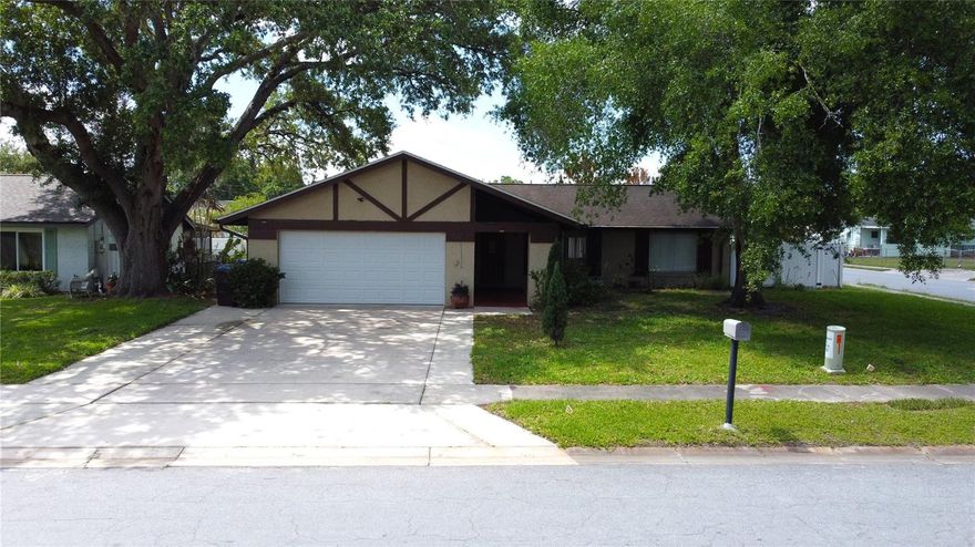 Welcome  to this beautifully upgraded corner lot home in the heart of Kissimmee where comfort meets thoughful design. Inside you will find tastefully updated bathrooms, a newer a/c system for peace of mind, and elegant wood flooring that flows seamlessly throughout the home, creating a warm and cohesive feel. The home features a huge kitchen filled with natural light, offering an open and inviting space perfect for cooking, entertaining, and everyday living. Large windows bring in an abundance of sunlight, making this the true centerpiece of the home. The layout is both functional and inviting highlighted by a fully enclosed patio that expands your living space-ideal for entertaining, working from home or simply relaxing year round. Step outside and enjoy the added privacy and curb appeal of a prime corner lot, complete with beautiful pavered areas perfect for gatherings and a lush, well-maintained garden that creates a peaceful outdoor retreat. Conveniently located near major roadways, shopping, and dining, this move-in ready property delivers the perfect blend of location, upgrades, and charm.