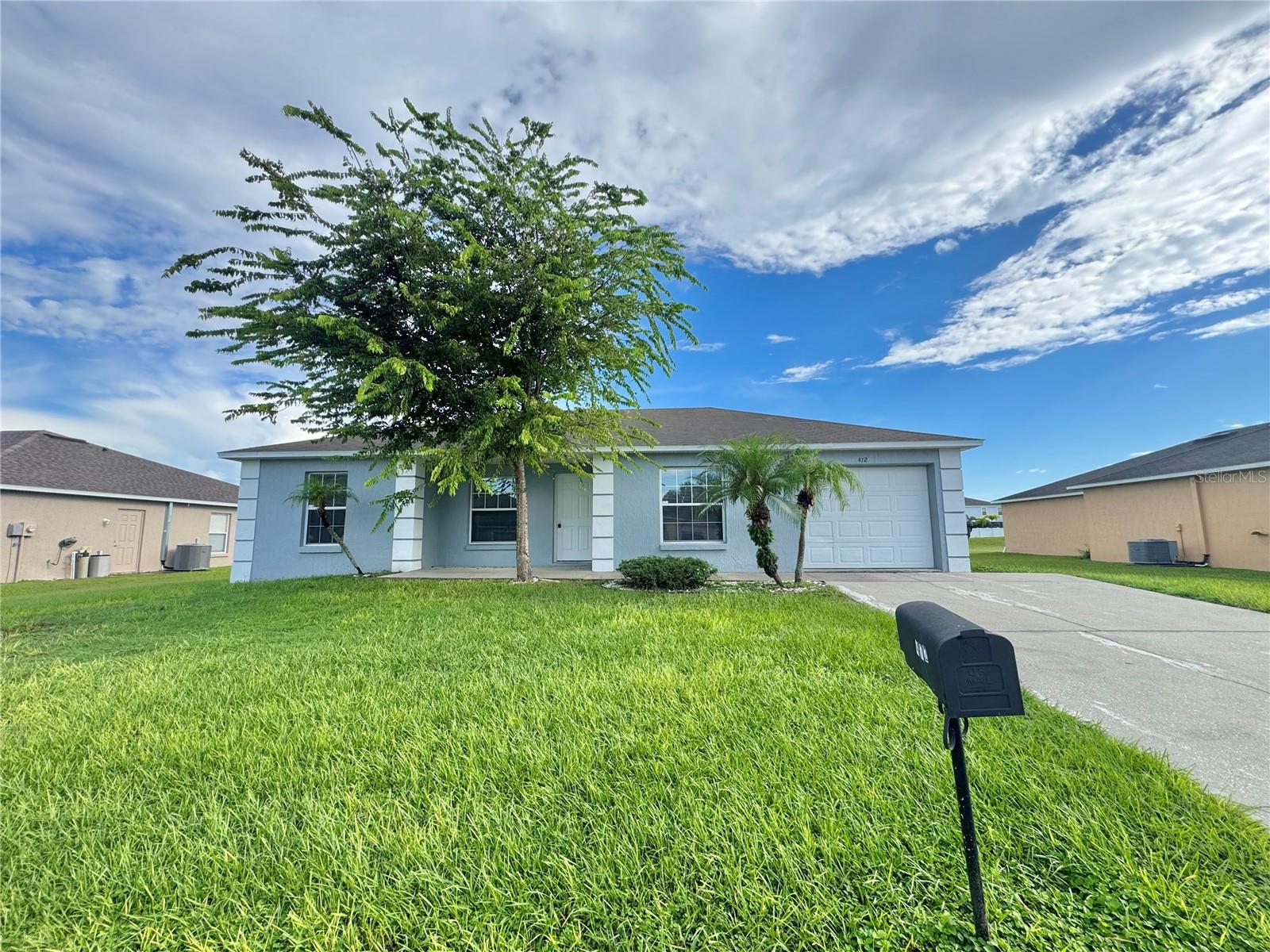 3-bedroom, 2-bath home with 1-car garage! Featuring a living room with high ceilings, dining area off the galley kitchen, and a split bedroom plan for privacy. The primary suite includes a 5x4 walk-in closet, while the other two bedrooms share the hall bath with. Enjoy a spacious backyard and convenient washer/dryer hookups in the garage. Move-in ready!