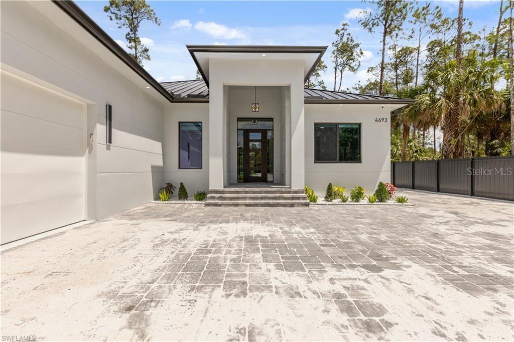 Fractional Ownership. New construction with an outstanding location, about five minutes from I-75, two minutes from the Publix plaza on the corner of Pine Ridge and Collier Blvd, about ten minutes from the beach and approximately twenty minutes from downtown area. Almost 2600 sqft of living area, where you will have 3 ample bedrooms with and den and 3 baths. With an extensive upgrades list starting with perimeter fence the full length of the lot and privacy panel level with the neighbors house and motorized gate, concrete paver driveway that continues the side of the house leading to the rear of the house, stem wall foundation, spray foam insulation with stucco soffit, metal roof and best of all pool and spa which are both electronically heated and screened, stamped concrete deck. On the inside all the windows and doors are impact resistant, tile thought the entire house and the bathrooms walls are porcelain sheets, an amazing granite selection, solid interior doors, nickel gap in the tray ceilings with beams, entertainment unit in the living room with an electric fireplace and TV included, custom cabinets and closets, smart toilet in the master bath. Some of the other upgrades are entire house reverse osmosis, mini fridge and grill with hood vented out to the side of the house in the lanai along with some more upgrade, wine cooler inside the home as well, storage units in the garage, camera systems installed already.