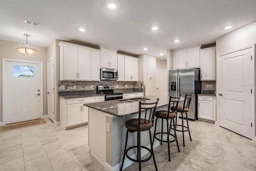 Photo of 10246 Echo Dock Loop, San Antonio, FL 33576 (MLS # TB8505406)