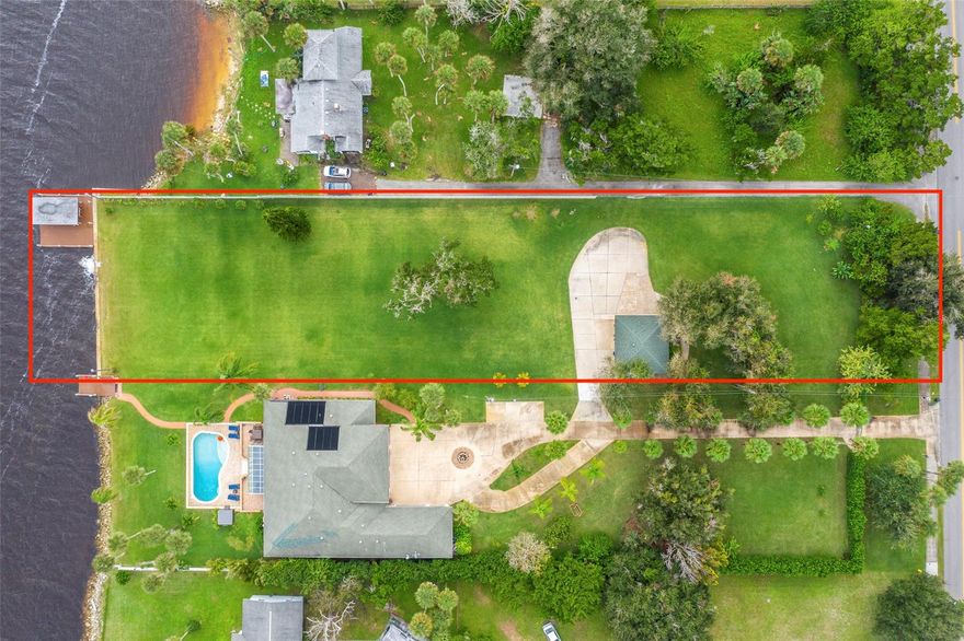Seller Financing: 25% down, balance at 3% for 15 years. Amazing Build-Ready 1 Acre Lot on the International Coastal Waterway. The dock has a 8000 lb. covered boat lift  and electricity, for all your boating needs. Composite planks were used on the dock, no splintering or wood rot. This landscaped vacant lot is ready for your new Dream Home Waterfront Oasis. Mangos, avocados and more! The 100' X 404' lot has an existing 2 car garage that was remolded with new garage doors and a new roof. Priced under value, lot appraised for $800,000.00 in May, 2020. ;Water: Available at Site