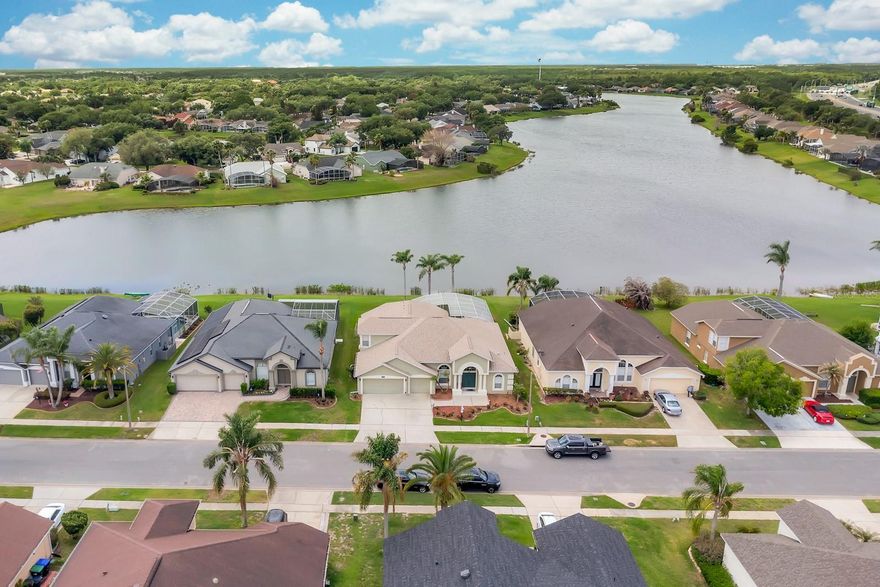 Welcome to your dream WATERFRONT oasis w/ 4 Bedrooms, 3 full bathrooms & a BONUS ROOM, in the highly sought-after Hunters Creek community. This stunning home offers a 3 WAY-SPLIT FLOOR PLAN & rare 3-CAR GARGE—an incredible luxury for Florida living. Significant updates for peace of mind ensuring reliability & efficiency for years to come: ***ROOF (Aug 2022), NEW PLUMBING (April 2021), A/C (March 2021)***As you step inside, you’re greeted by a formal dining & living area, with a direct line of sight to the breathtaking screened lanai & pool, bathed in natural light & serene lake views. Tucked away on the right, the luxurious owner’s suite is a private retreat, complete with sliding doors to the lanai, tranquil lake vistas, a double vanity, a soaking tub, and a standalone shower. On the left, the OPEN-CONCEPT kitchen and family room flow seamlessly, with a cozy dining nook, lots of kitchen counters & a pantry. 3 additional bedrooms & 2 full baths ensure plenty of space and PRIVACY for family or guests. Don’t miss the upstairs BONUS ROOM, newly carpeted & ready for your imagination—a perfect FLEX-SPACE (the only space on the 2nd floor). Outside, the backyard is a paradise—enjoy SPECTACULAR SUNSET as you relax poolside. LOCATION, LOCATION, LOCATION...Close to Major Highways & employers, Top-Rated Schools, Minutes to ALL Theme Parks, International Airport, Hospitals, The loop Mall, Vibrant Shopping & Dining! All within easy reach! Come experience luxury living at its finest. Contact the Listing Agent to view this gorgeous home before it's gone!