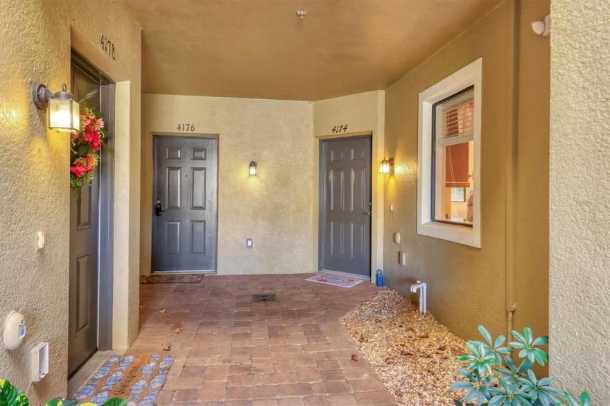 DESIGNER DECORATED and TURNKEY FURNISHED, this RARELY AVAILABLE CARLISLE floor plan with 3 bedrooms, 2.5 baths and a stunning lake view is ready for immediate occupancy! ROOF REPLACED IN 2024, NO FLOOD INSURANCE NEEDED! This gorgeous and pristine condo has been lightly lived in and meticulously maintained offering a newer AC unit in 2020, hurricane shutters, surround sound on the first floor, and updated luxury vinyl on the stairway. On the main floor you will find a beautifully designed kitchen with granite countertops, stainless steel appliances, 42" wood cabinetry, spacious dining room, great room, half bath and peaceful lakeview from the screened in lanai. The second floor has the master suite which is situated on the back of the condo for privacy offering a walk-in closet and master bath with granite countertops and a laundry closet down the hall for ultimate convenience. The guest rooms are on the other end of the condo with a shared bath. Live the ultimate Florida lifestyle as this complex is MAINTANANCE FREE with fabulous amenities including a heated resort style pool, state of the art fitness center, clubhouse with kitchen, playground and miles of walking and biking trails close by. Palma Sola Trace is a short drive to the amazing beaches of Anna Maria Island, Bradenton Beach and Longboat Key. Cortez Fishing Village is even closer, as well as Desoto State Park and Robinson Nature Preserve! So much nature nearby as well as amazing dining and shopping options!