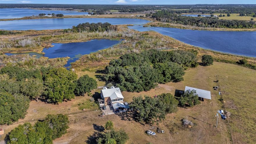 North Lake County Waterfront Ranch and Home is an opportunity to purchase roughly 240 ± acres in an extremely
desirable part of Lake County. This property can serve as a secluded home place for an individual or family seeking
hunting, fishing, recreational, and ranching opportunities. Combined there is roughly 10,157 ± feet of frontage on
multiple lakes with one 4.5-acre lake being completely internal to the property. The ranch is mostly comprised of
improved pasture on the south end while transitioning into large live oak hammocks as you head towards the
northern boundary. The improved pasture is completely cross fenced with a central penning lane allowing for
rotational grazing and easy gathering of cattle. There is a 2,997 ± square foot 3 bedroom, 3 bathroom house that was
built in 2008 on site. Additionally, there are other barns and agricultural structures on the ranch as well. There is
roughly 1,805 ± feet on road frontage of CR 450 ensuring easy access and land appreciation as a prospective buyer
looks into the future. The extensive road frontage could also provide a potential buyer with ability to subdivide
whether it be for re-sale or to create a family compound.

The cattle and some equipment on the ranch is up for discussion and can be purchased separately should a buyer be
interested. Contact Zeb Griffin for more information.