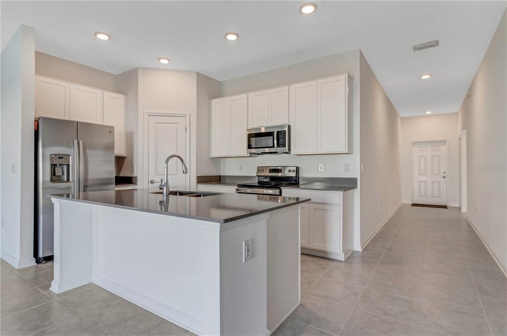 Photo of 865 Citrus Reserve Boulevard, Davenport, FL 33837 (MLS # O6443512)