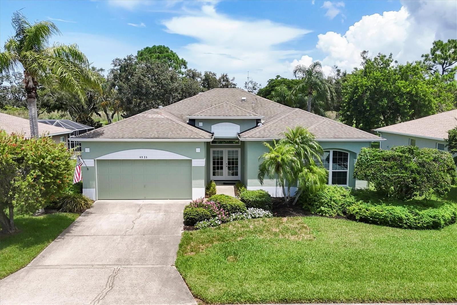 One or more photo(s) has been virtually staged. Welcome to 4925 Thames Lane, a fully updated, 3 bedroom, 2 bath home offering nearly 2000sf of modern, stylish living in a quiet, well-maintained Sarasota community with a low HOA fee. From the moment you enter, you'll notice the fresh, like-new feel - thanks to brand new luxury flooring and crisp interior and exterior paint. The home is filled with natural light from the large, double front doors as well as the sliders and windows throughout. You'll never be short of counter space in the large, eat-in, chef-inspired kitchen featuring quartz countertops, stainless-steel double sink, all new, quiet-close cabinets, under cabinet lighting, double pull-out garbage cans, new LED recessed lighting and beautiful, white appliances. The four-season lanai off of the family room has electricity and a cable outlet for relaxing year-round. The home is packed with value and peace of mind upgrades, including: new hurricane impact windows, doors and sliders, 4 ceiling fans, irrigation system, new water heater, new bathrooms with modern finishes, spacious bedrooms with generous closets, an attached garage large enough for two cars and storage shelves, and a beautifully landscaped backyard, large enough for a pool. Located in flood zone X, this desirable Sarasota neighborhood is close to shopping, dining, I-75, Legacy Trails, and the world-famous Siesta Key Beach.