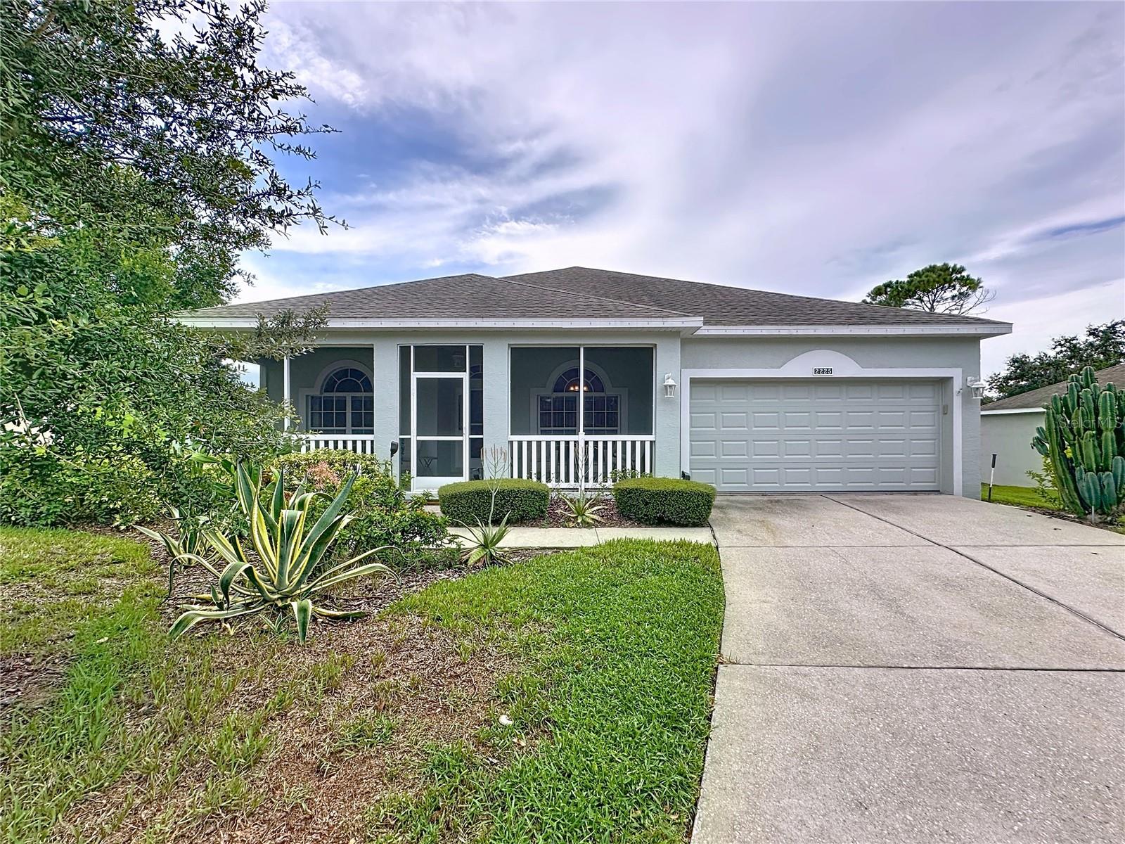 St Clair model on the Golf Course located in a quiet cul de sac. This particular home has the larger screened - in front porch. All new stainless steel appliances bought about 2 yrs ago. New roof in March2016 and HVAC change out in April 2022. The inside of the home has been painted in all one neutral color. There is tile in all the rooms except the 2 bedrooms that have carpet. The Primary bathroom has undergone a major remodel - the tub was removed and a large no lip walk- in handicap assessible shower that can accommodate a wheel chair was installed. This shower has 2 separate lines - one for stationary shower head and one for a hand held. The guest bath has a new vanity, comfort height toilet and an additional light over the tub. The garage is 2 ft deeper than the regular model and can fit a large truck. There is also an overhead pulldown screen in the garage. The lanai has a new fan/light and switch. The lanai also has UV resistant screens. A new whole house surge protector as added in 2025. Rescreened 90% of the windows on the East side & 80% of the windows on the West side. The Golf Cart is negotiable. The furniture is also negotiable. Kings Ridge is a 55 Plus gated golf community located in the rolling hills of Clermont, FL. Enjoy the Royal life style in the multi-million $ clubhouse with 3 heated pools, spas, tennis & pickle ball courts, billiards, shuffle board, shows, Bingo, cards and clubs galore. The monthly maintenance fees include: lawn maintenance including trimming of shrubs, care of irrigation system & irrigation water, internet, TV & home phone thru Fiibernow/Opticaltel , maintenance of roads and outside painting of home every 7 years. Take your golf cart to the Kings Ridge Plaza where you can do your grocery shopping, banking or dine out. Approximately 30 minutes to Disney Parks or Universal Studios.
