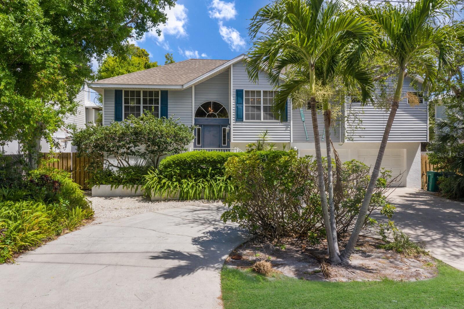 This canal front property is an exceptional opportunity for those looking to engage in short-term rentals or design their ideal beach retreat. It features three bedrooms, two bathrooms, and a spacious two-car garage. Unique to this home are the two docks equipped with boat lifts and additional mooring for a third boat, making it perfect for those seeking saltwater in their soul. The property's serene waterfront setting is enhanced by a lush mangrove line, providing privacy and a beautiful natural backdrop. Practical additions include substantial under-house space suitable for a workshop or extra storage, a covered patio for relaxed outdoor living, and an expansive upstairs deck ideal for entertainment or quiet reflection. With ample room to install a pool, this home is a canvas ready for your vision, offering numerous possibilities to enhance its charm and functionality in a highly desirable location. Just steps to one of the best beach access’s on Anna Maria Island and easy access to all the shopping and dining along Pine Avenue. Don’t miss out and create your perfect slice of island life!