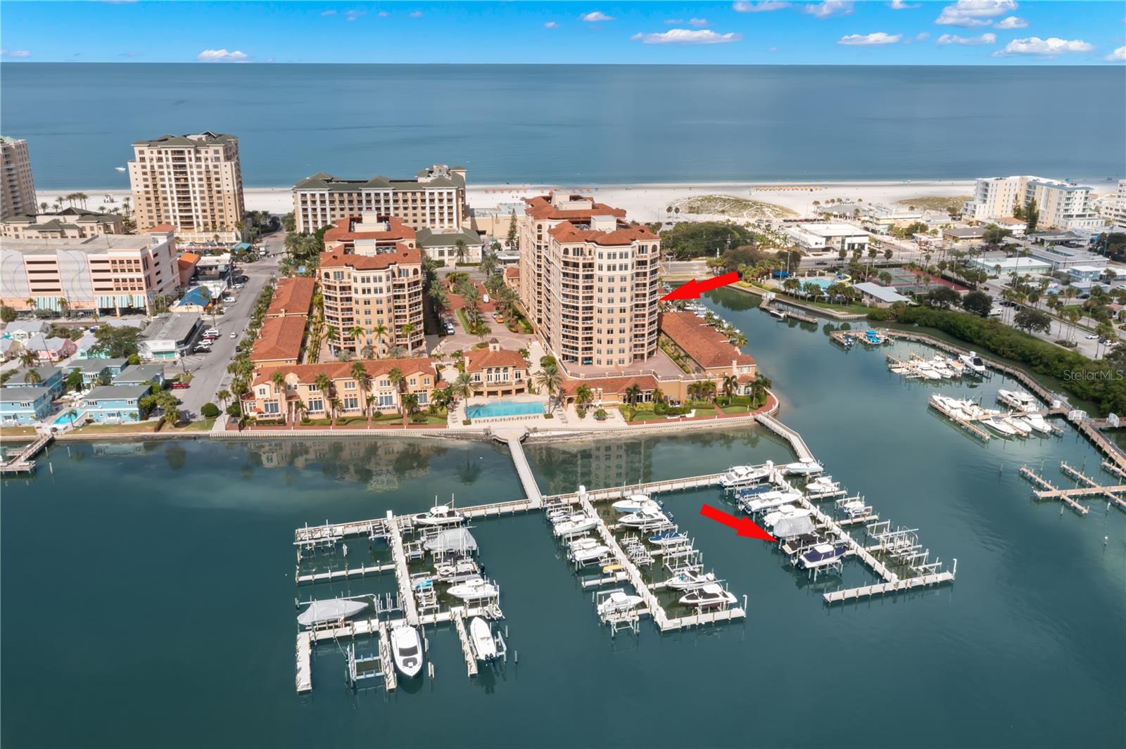 Introducing a Luxurious Waterfront Haven: Panoramic Intracoastal Waterway Views Await You from every window plus views of the Gulf! Welcome to this lavish 2087 square foot corner unit that comes totally furnished, boasting 3 bedrooms, 3 full bathrooms, two breathtaking balconies that frame the awe-inspiring water vistas. Water enthusiasts will delight in the two new boat lifts – a 20,000 lb lift for your boat and a 6,000 lb lift for two jet skis, providing the perfect launchpad for your aquatic adventures. Nestled in a prime location, this condo offers a premier assigned underground parking spot, conveniently situated just steps away from the lobby entrance. As you ride the elevator to the 8th floor, you'll discover a truly exclusive oasis. This floor features only two units, ensuring your privacy and tranquility, separated by an elegant stairwell. The condo's layout is designed with privacy in mind, offering a triple split plan that provides water views from every bedroom. Meticulously updated and exquisitely appointed, this residence offers a lifestyle of unparalleled luxury. Upon crossing the threshold, your eyes will be immediately drawn to the expansive water views that beckon from the open great room and dining area. These areas are adorned with impact-rated sliders that lead to a generous balcony, where you can savor your morning coffee while watching the world awaken. The kitchen is a chef's dream, featuring shaker cabinets, a large granite countertop, stainless steel appliances, a cozy breakfast nook with water views, and a convenient kitchen bar for casual dining or entertaining. The spacious primary suite is a true retreat, offering direct water views and sliders leading to the balcony. It boasts luxurious appointments, including two walk-in closets and an updated ensuite bathroom with a standing tub, dual vanities, a large shower with dual showerheads, a rain showerhead, and a seating area. Two equally spacious guest suites also offer stunning views and ample closet space. One of these guest suites even features its own ensuite bathroom and a private balcony, ensuring the utmost comfort for your guests. For those who love to entertain, the condo features a nautical-themed wet bar with granite countertops, a wine fridge, a sink, and a secret garage bar to showcase your private collection. Additional features include electric window shades, crown molding, and ceiling fans throughout. Belle Harbor, a Mediterranean-inspired oasis, is ideally situated in the heart of Clearwater Beach and a 2 min walk to the beach. Residents enjoy access to a top-notch fitness center, a stunning pool overlooking the water, a spa, an outdoor fireplace, patio areas, a marina, social rooms, a billiard room, and the peace of mind of a 24-hour manned gatehouse. Pet friendly where you can have 2 pets with a max weight of 80 pounds. Rentals are allowed with a 30 day min. With restaurants, bars, and the community center next door with Outdoor Basketball Courts, Outdoor Pickleball, Lighted Tennis Courts and much more. Clearwater Beach just across the street, you'll relish in the convenience of this prime location. It's time to live your best life in one of Tampa Bay's most desired condo buildings on the water. Located right next door is the Clearwater beach Library where you can join many community activities. Don't miss the opportunity to make this exquisite waterfront condo your new home and come live your best life! Call today for your private tour.