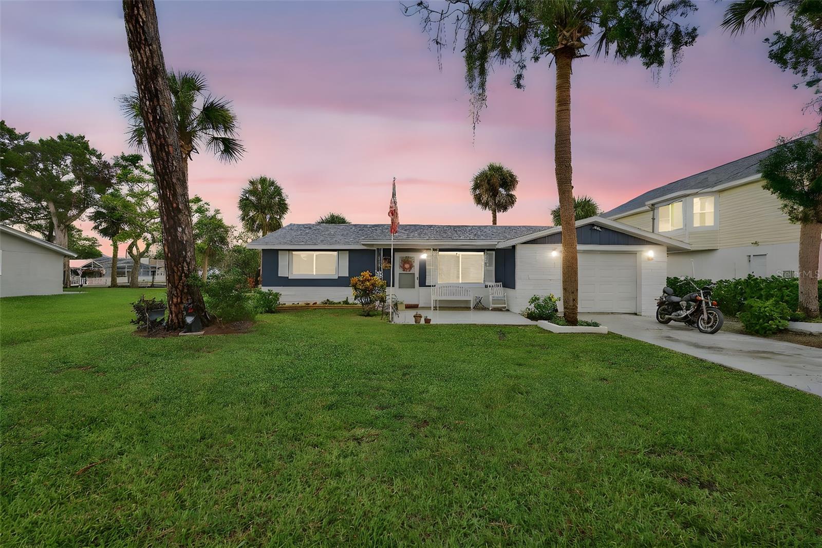Brand new roof (07/2025) just installed on this beautifully renovated home with easy canal access! All updated electricals also adhere to the strict Pasco Country codes. Step inside to discover stunning new floors and modern windows that fill the space with natural light. The remodeled garage offers added functionality and curb appeal. This move-in ready home boasts a bright, open layout perfect for everyday living or entertaining. The kitchen and bathrooms have been tastefully updated to match today’s style and comfort. Enjoy peaceful mornings or relaxing evenings with canal access that leads to the stunning Millers Bayou. Whether you're into boating, kayaking, or just soaking in the view, the location can’t be beat. Nestled in a quiet, friendly neighborhood with convenient access to local dining, shops, and schools. Every detail has been thoughtfully updated so you can move in with ease. Don’t miss your chance—schedule your private showing today!