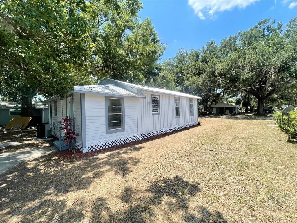 Photo of 630 N Nashua Avenue, Fort Meade, FL 33841 (MLS # O6374740)